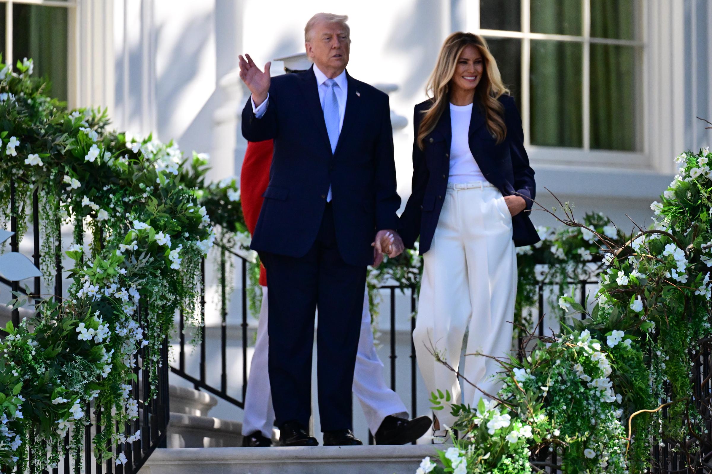 President Donald J. Trump and First Lady Melania Trump greet the crowd during the 2026 Easter Egg Roll at the White House, Washington, D.C., US, on April 6, 2026. | Source: Getty Images