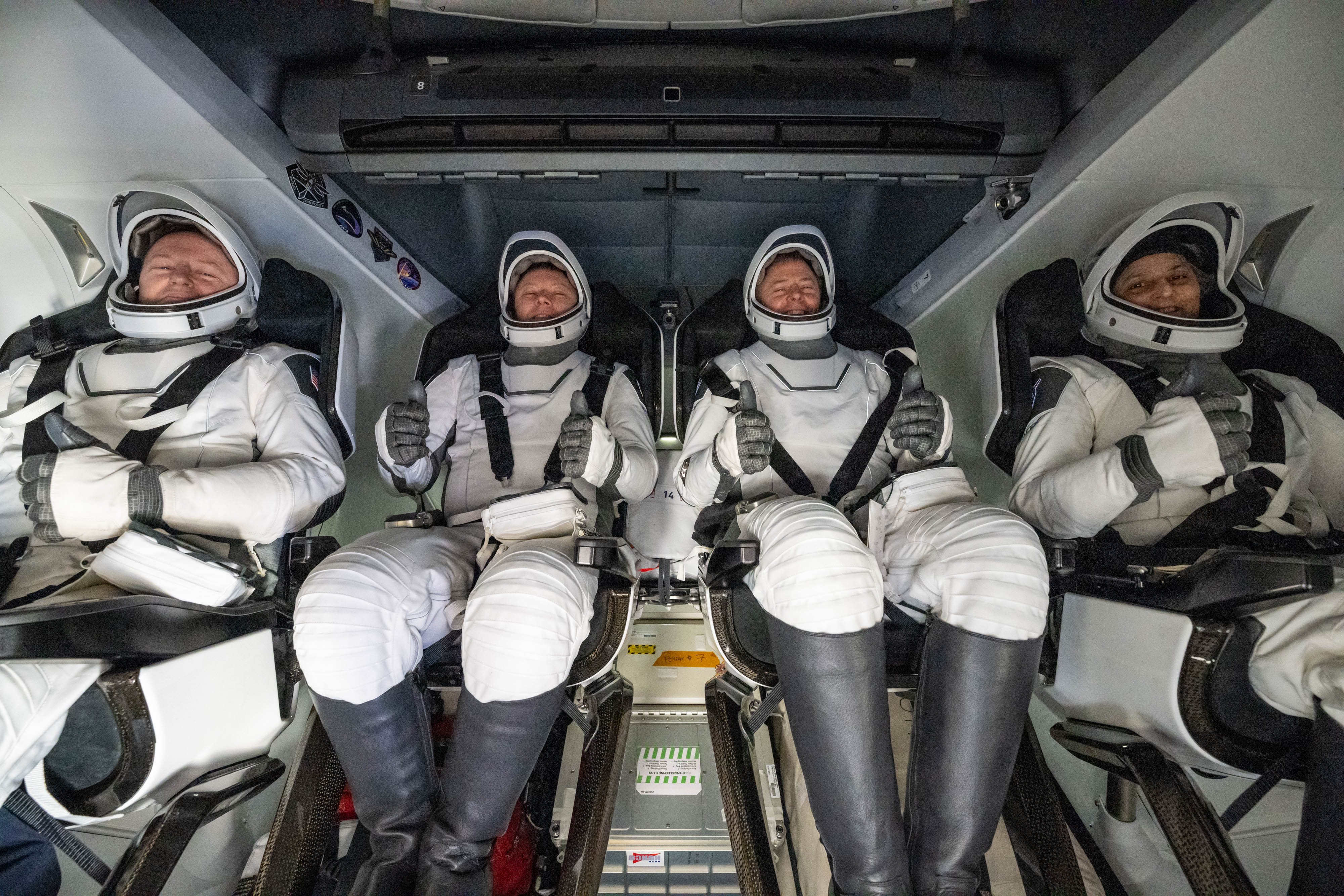 Butch Wilmore, Aleksandr Gorbunov, Nick Hague, and Suni Williams are seen inside a SpaceX Dragon spacecraft onboard the SpaceX recovery ship MEGAN shortly after having landed off the coast of Tallahassee, Florida, on March 18, 2025 | Source: Getty Images