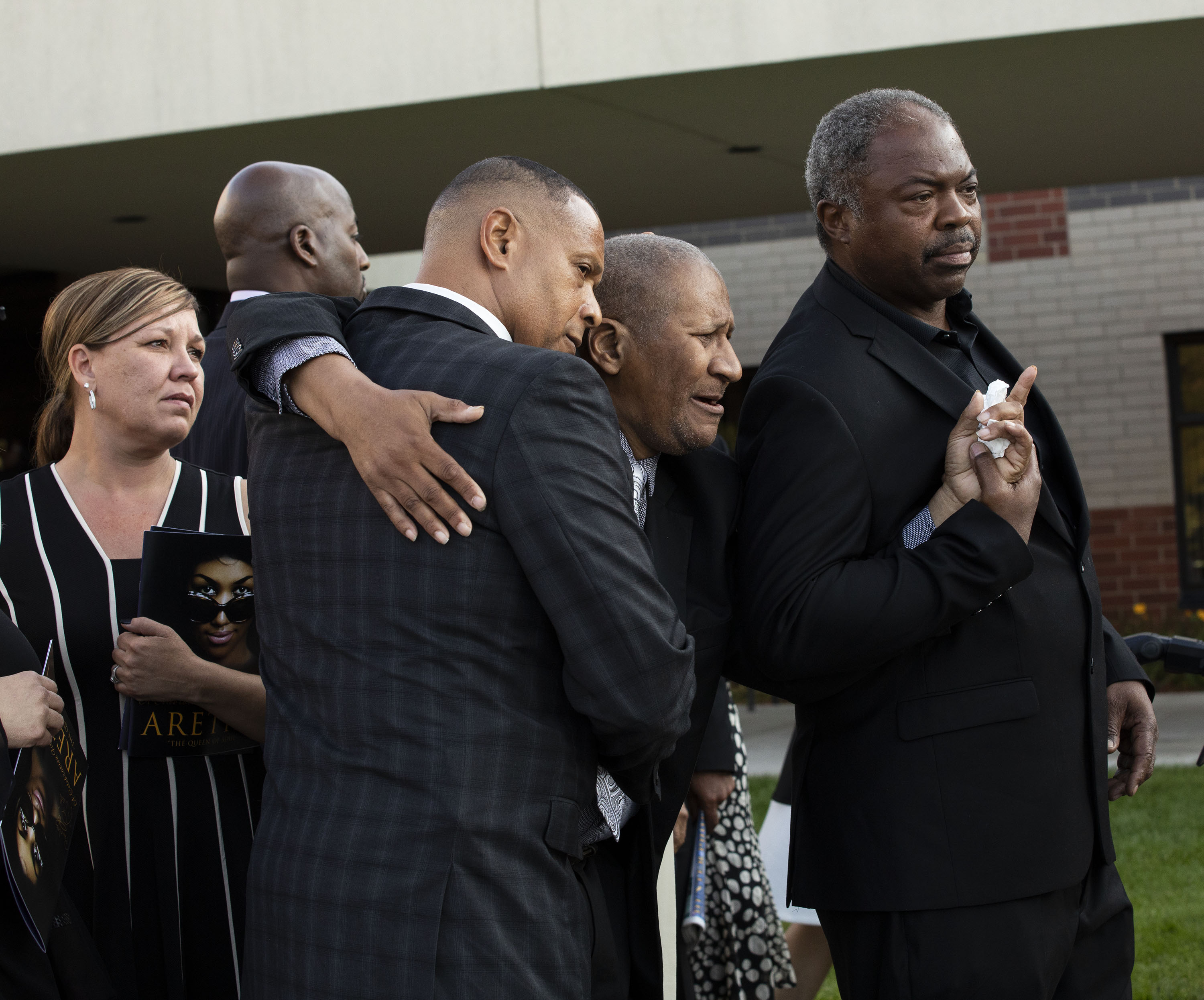 Aretha Franklin's eldest son, Clarence Franklin, pictured at the center of two men mourns the death of his mother outside Greater Grace Temple following her funeral on August 31, 2018 in Detroit, Michigan. | Source: Getty Images