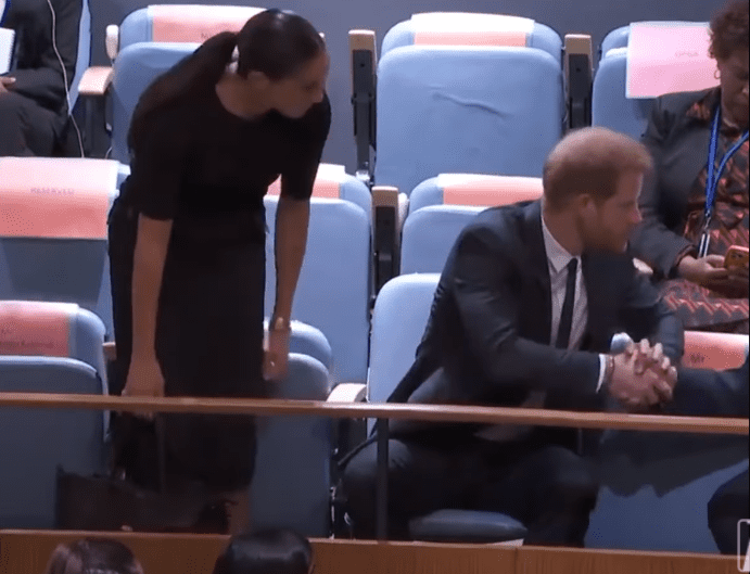 Meghan Markle photographed standing up while leaning on to Prince Harry at the General Assembly during the Nelson Mandela International Day at the United Nations Headquarters on July 18, 2022 in New York City.┃Source: YouTube/@TheBodyLanguageGuy