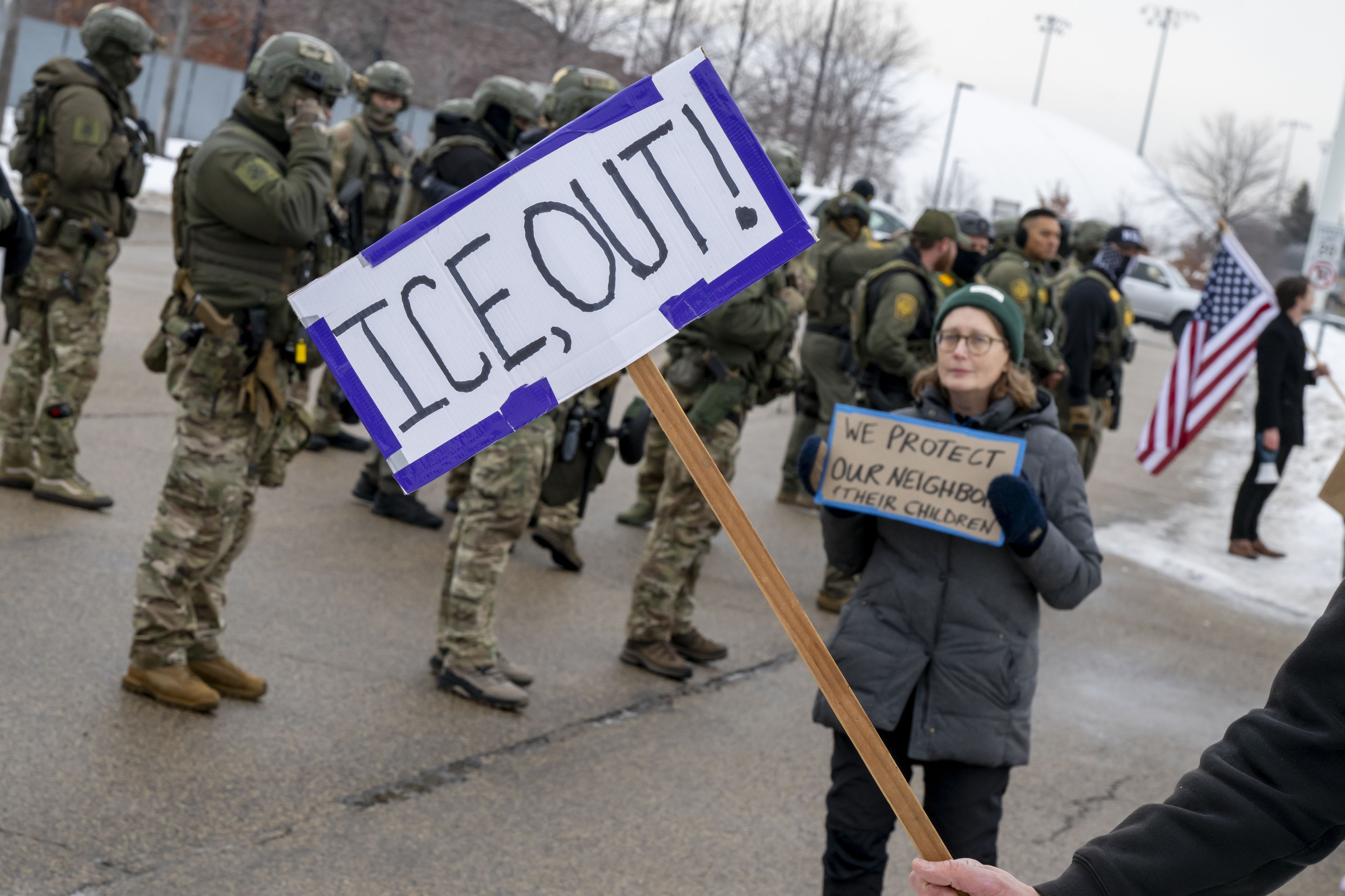 Protestors standing outside the Whipple Federal building on January 8, 2026, in Minneapolis, Minnesota | Source: Getty Images