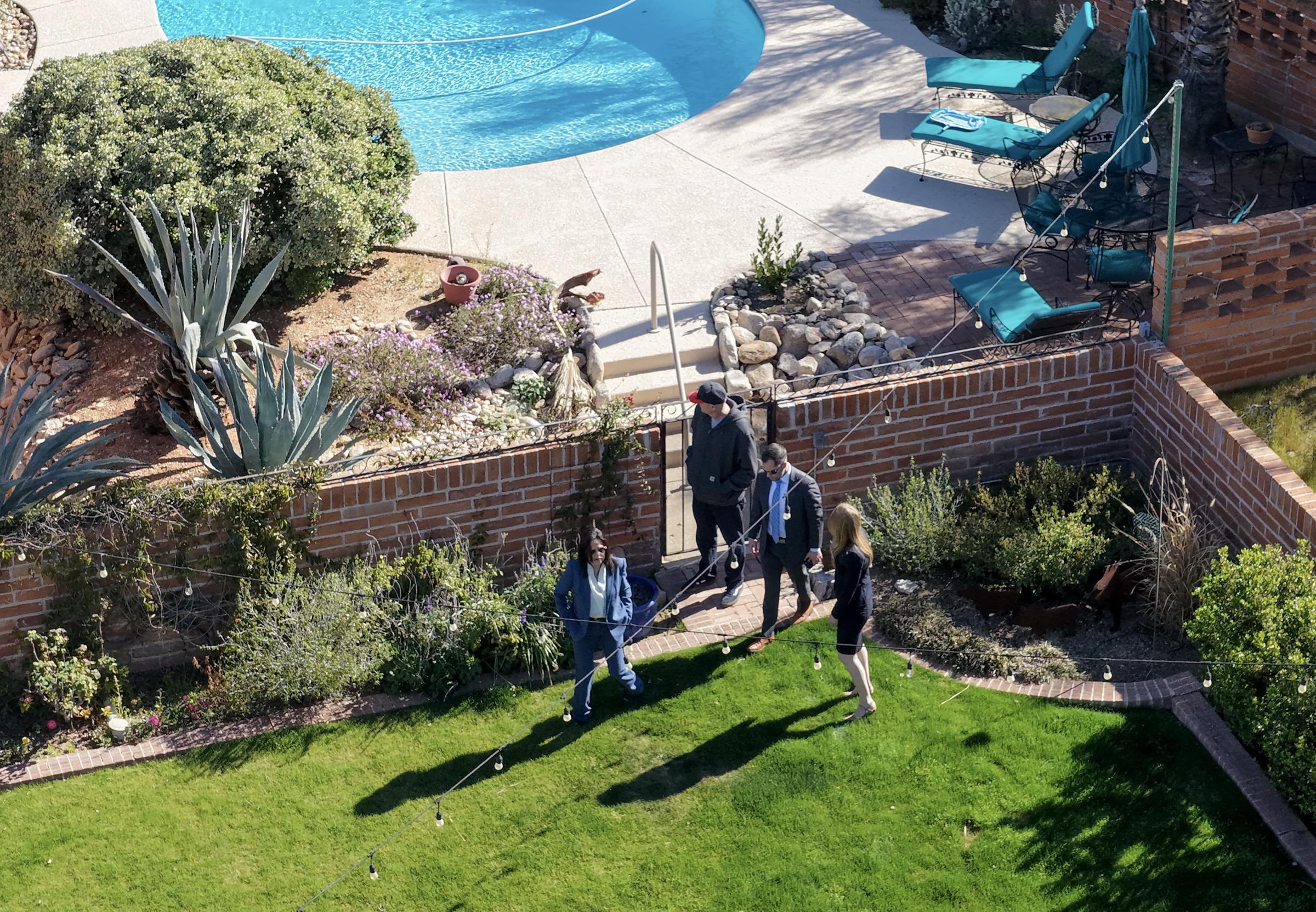 Law enforcement officials search the property of Nancy Guthrie in Tucson, Arizona, on February 25, 2026 | Source: Getty Images