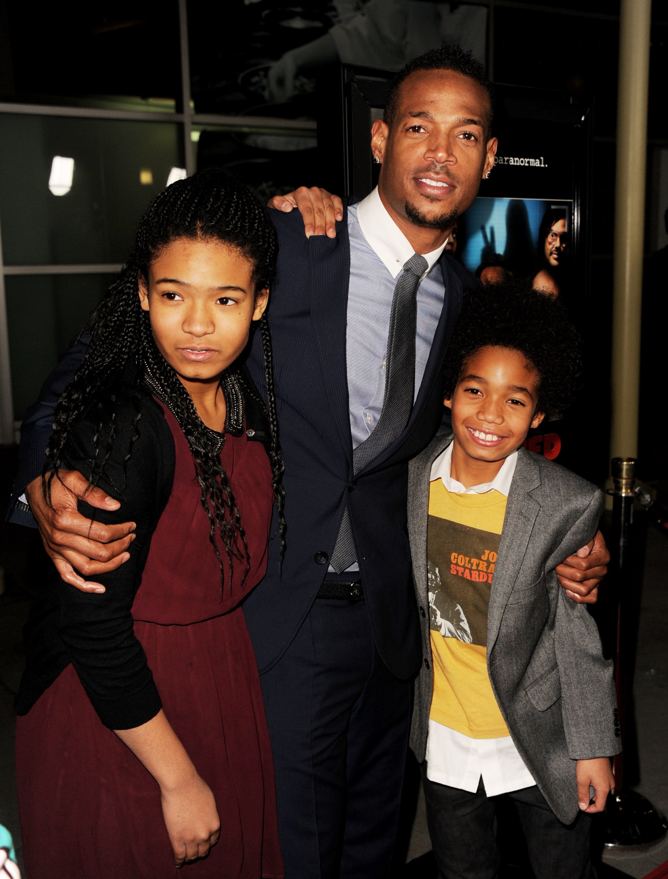 Marlon Wayans and his daughter Amai and son Shawn pose at the premiere of Open Road Films' "A Haunted House" on January 3, 2013, in Los Angeles, California. | Source: Getty Images