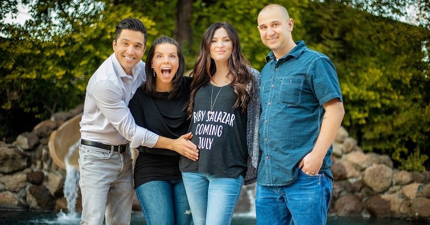 Amy Carabba, her husband Pablo Salazar, and the surrogate family carrying their baby | Photo: Courtesy of Amy Carabba