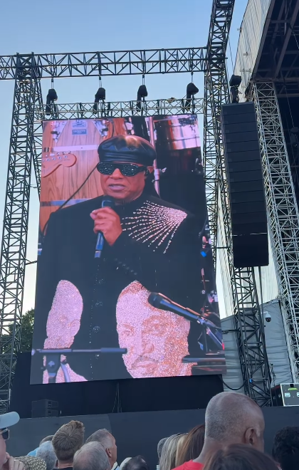 Stevie Wonder seen on a concert screen talking about the rumors about his eyesight during his tour stop at Cardiff, Wales on July 10, 2025 | Source: Instagram/cardifflife.wales