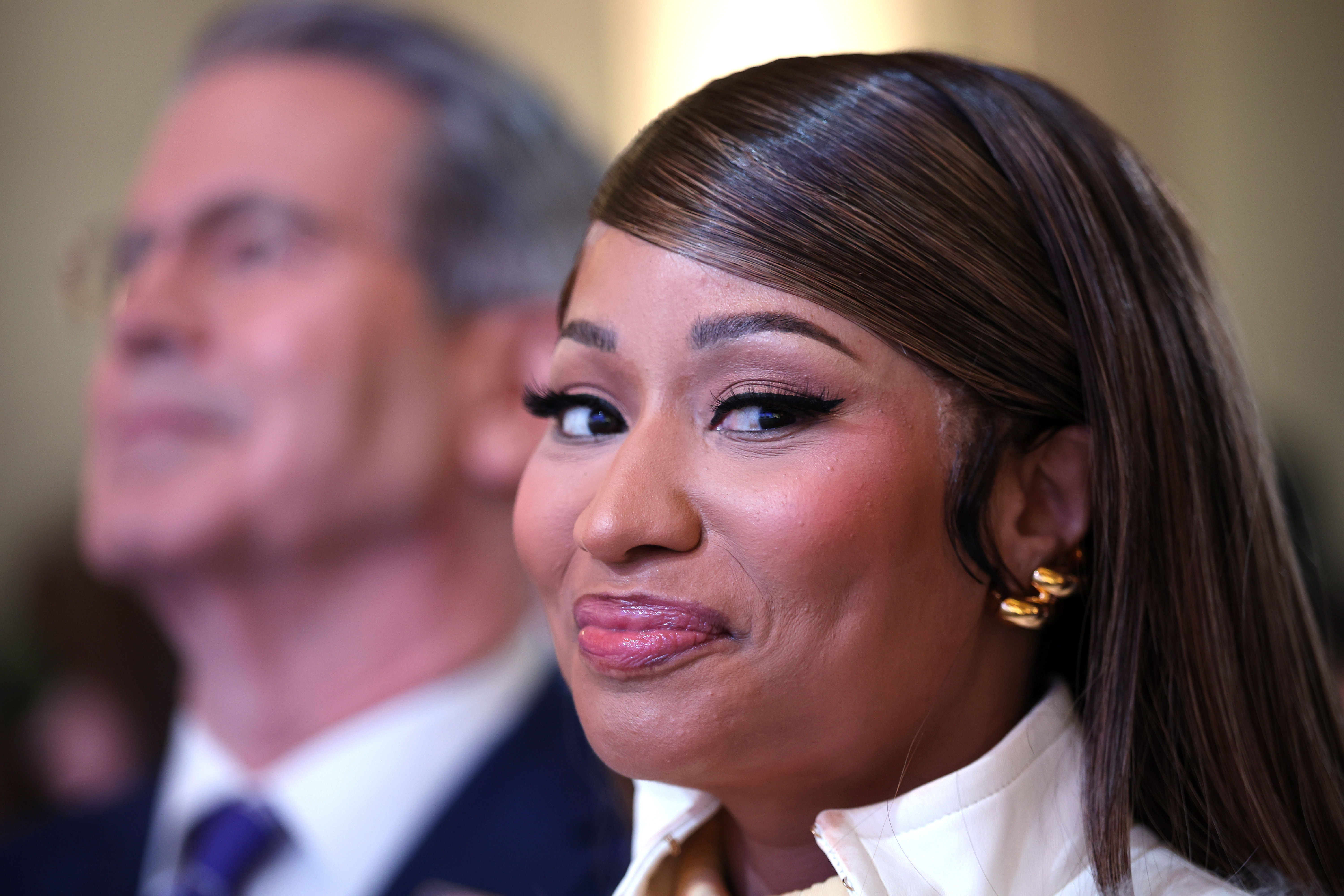 Nicki Minaj smiling at the camera for a photo. | Source: Getty Images