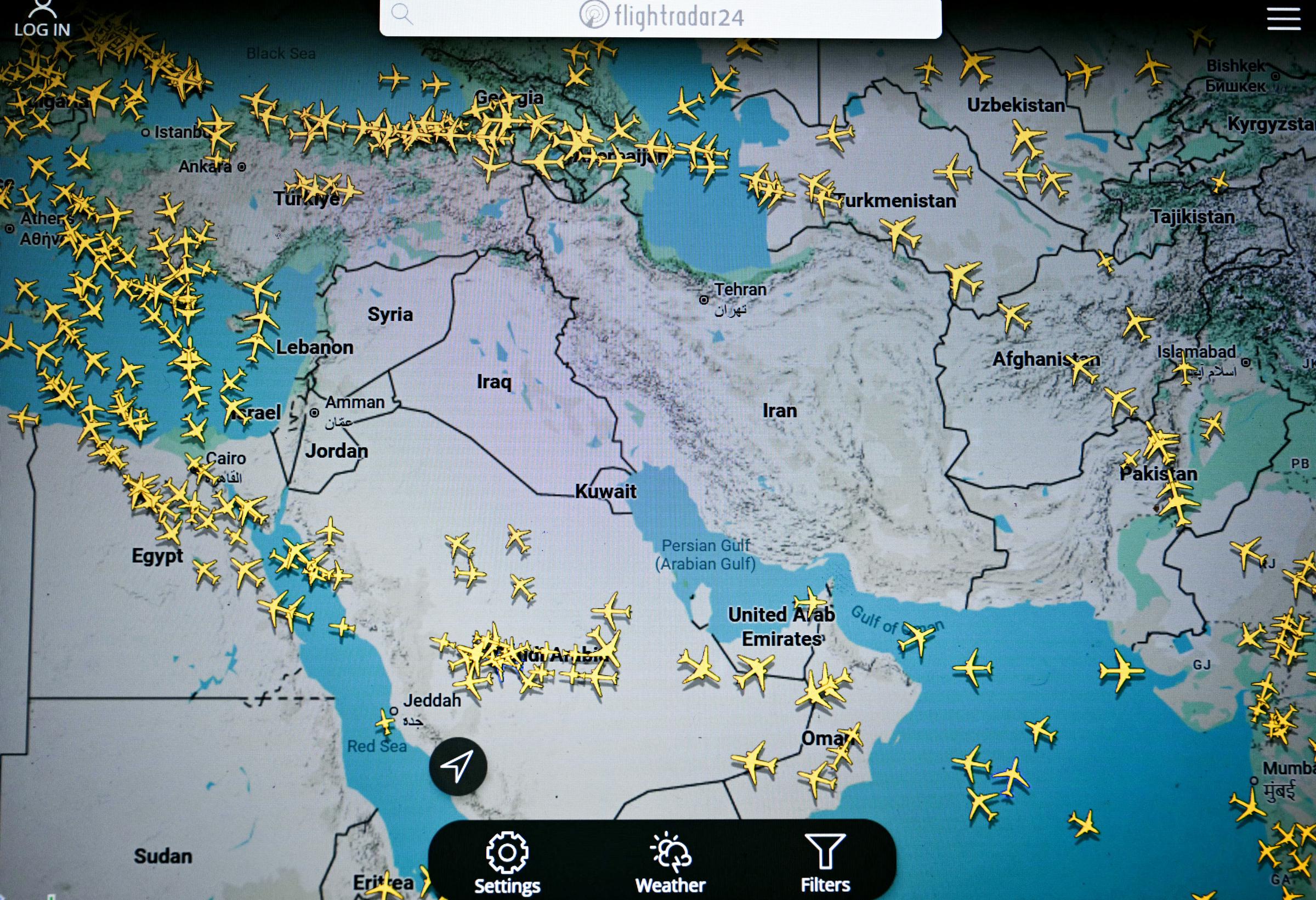 This photograph, taken in Paris on 1 March 2026, shows a page on the Flightradar 24 website displaying civilian flights avoiding the Iranian and Iraqi skies. | Source: Getty Images