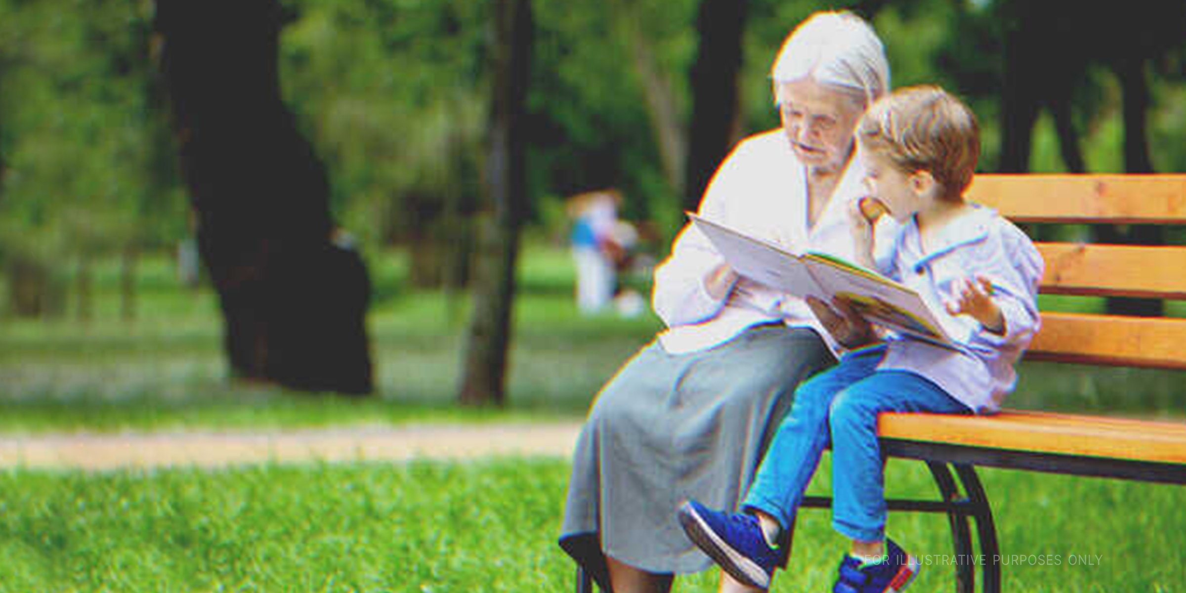 Grandmother and grandson on park bench. | Source: Shutterstock