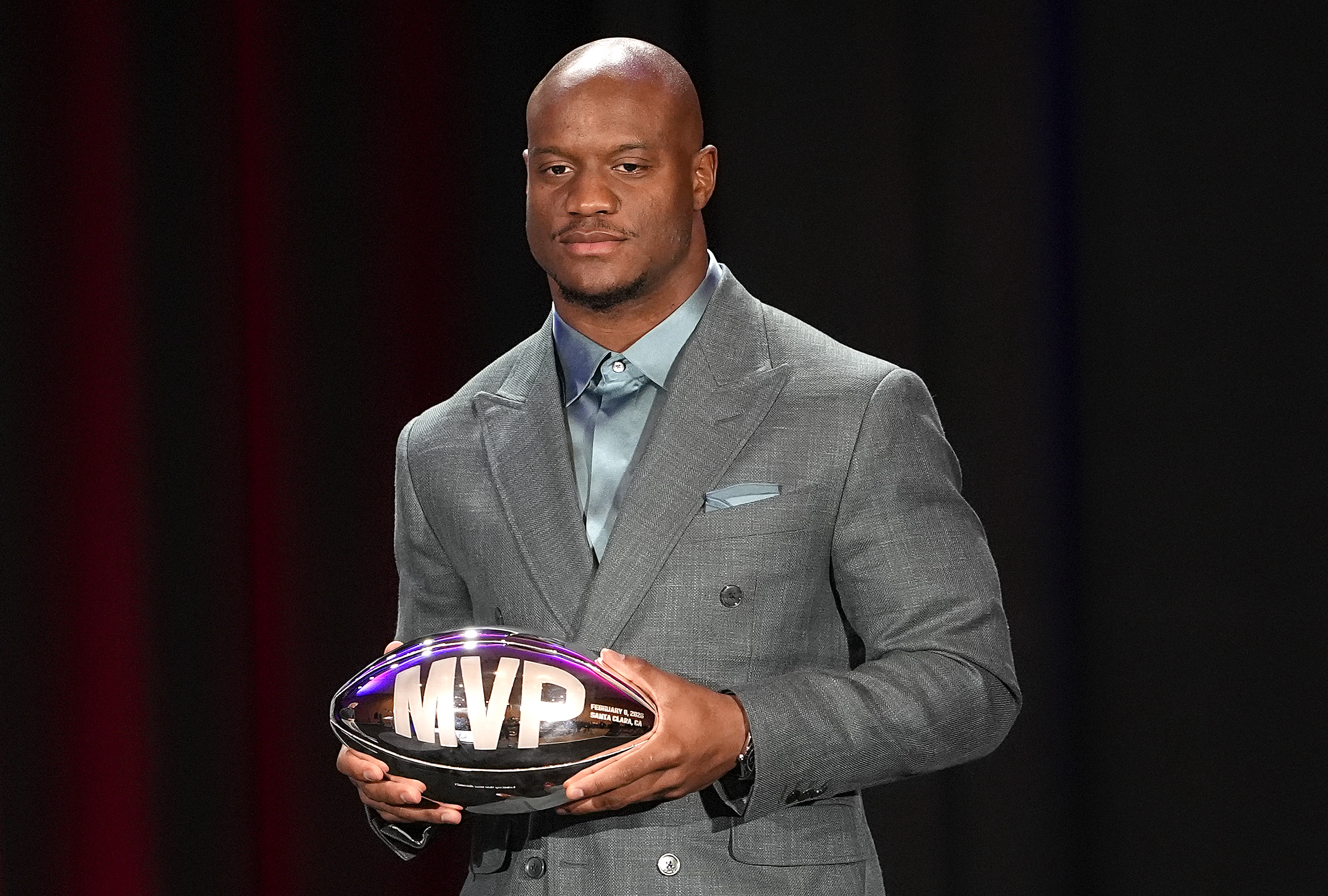 Kenneth Walker III holds the Super Bowl MVP trophy during a postgame press conference on February 9, 2026 | Source: Getty Images