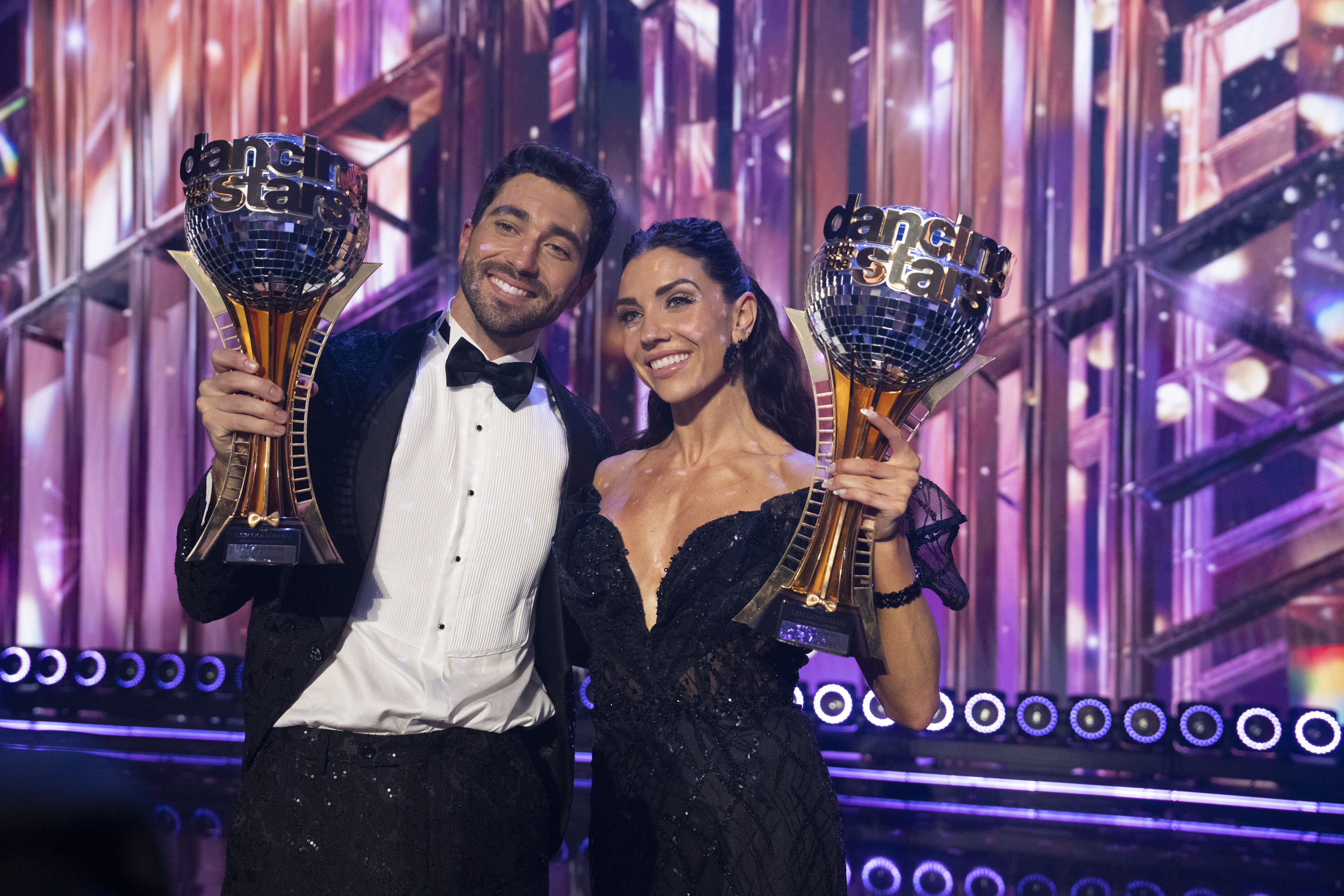 Joey Graziadei and Jenna Johnson hold their Mirrorball Trophy during "Dancing with the Stars" on November 26, 2024 | Source: Getty Images