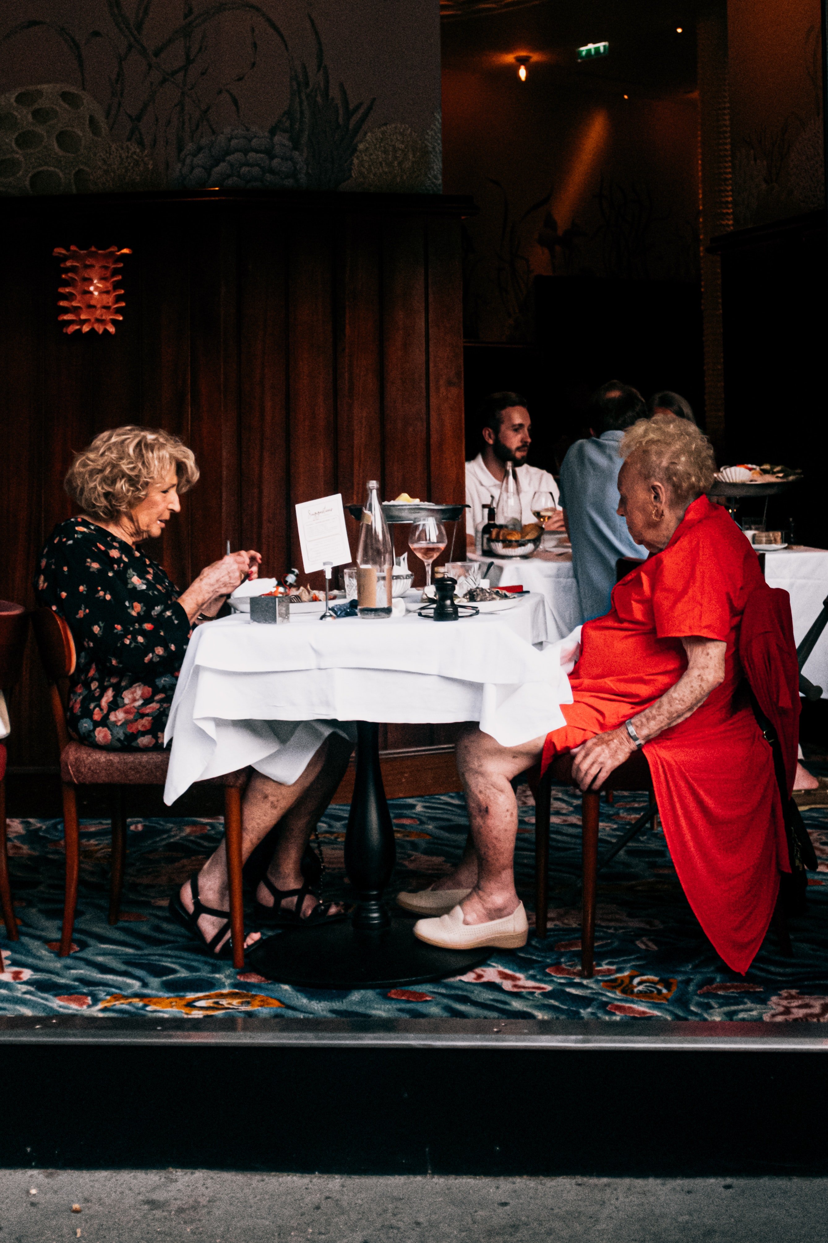 A photo of two elderly women enjoying lunch. | Photo: Pexels