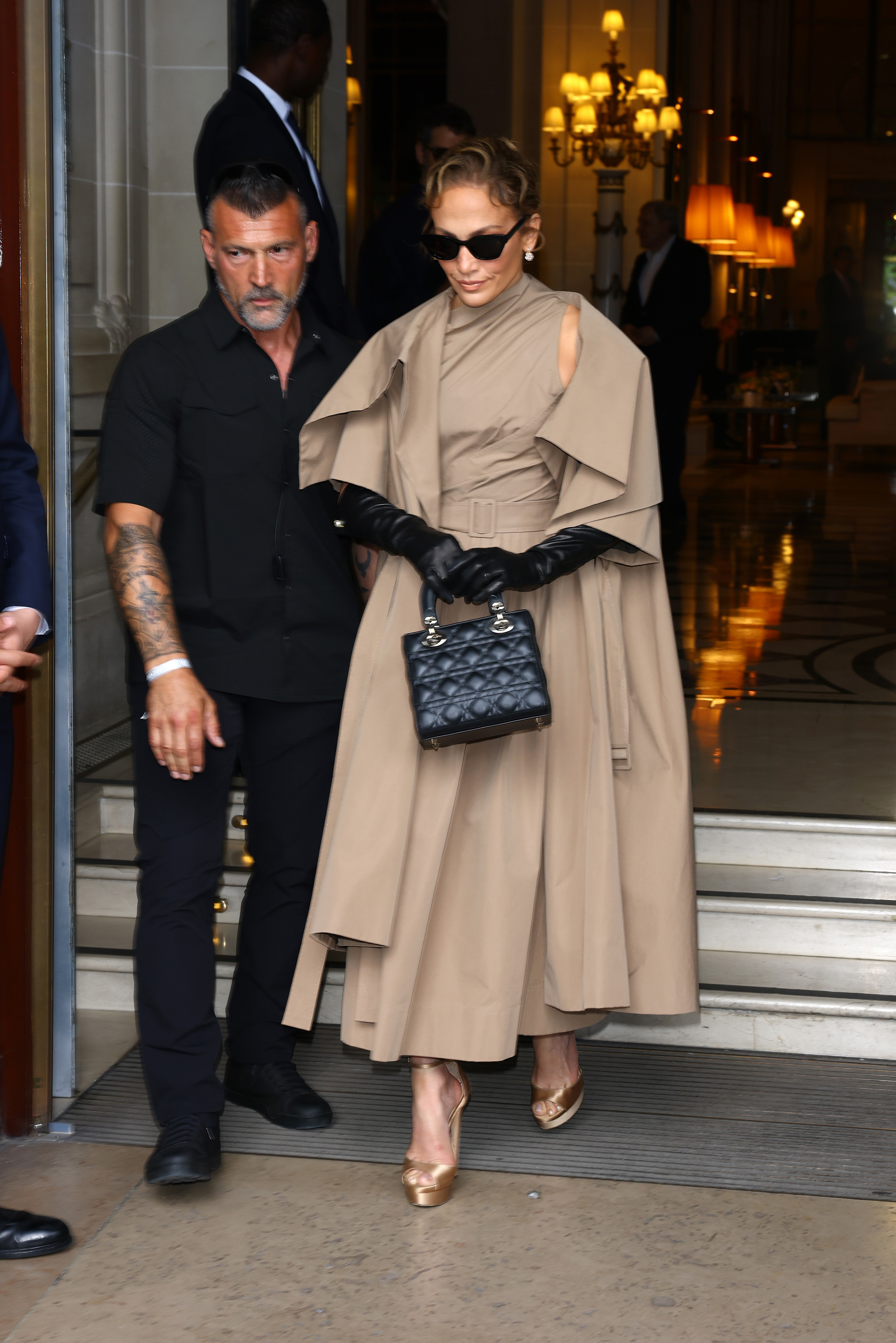 Jennifer Lopez walks with security beside her at Christian Dior's Fall/Winter 2024 Haute Couture show during Paris Fashion Week on June 24, 2024. | Source: Getty Images