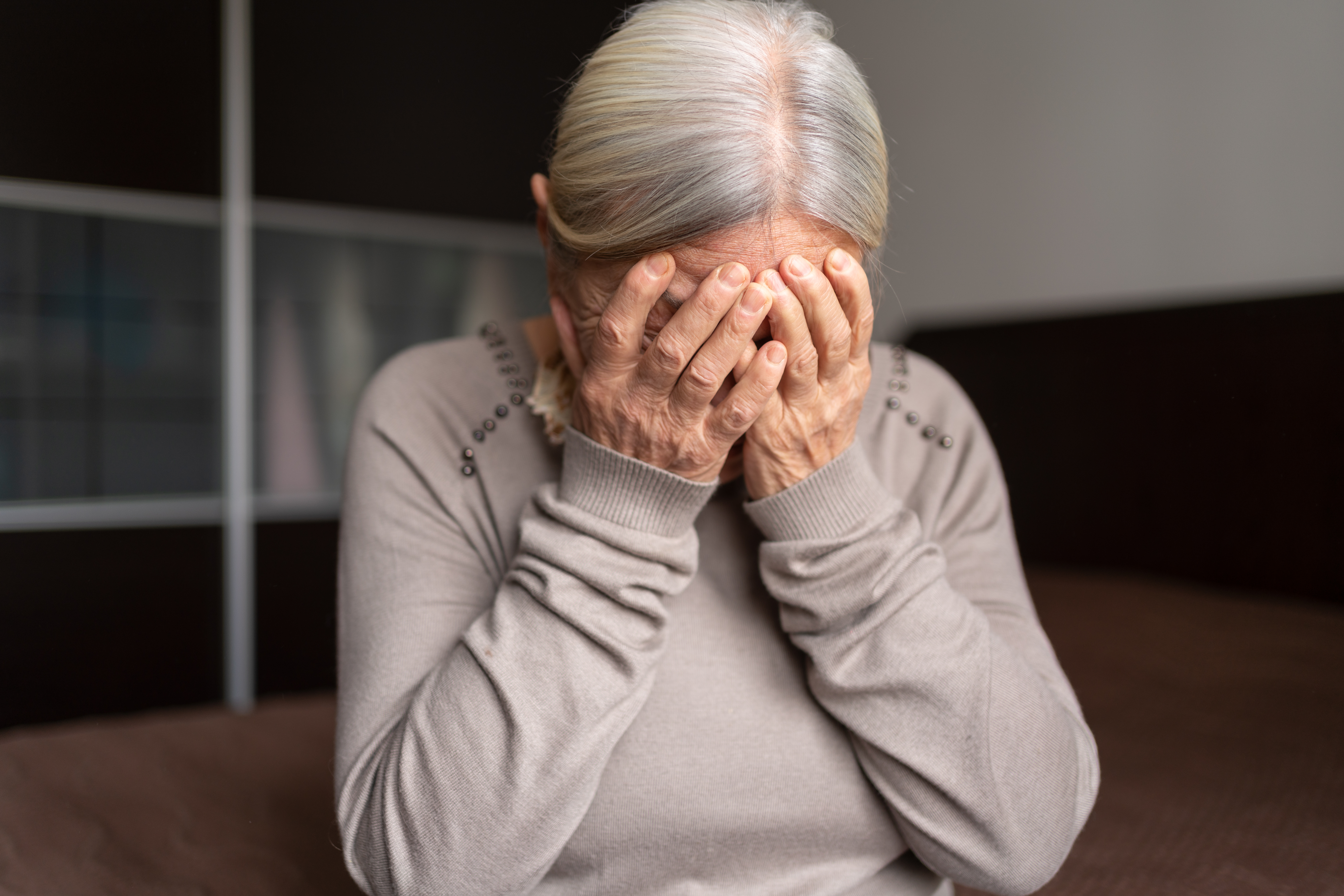 Depressed Lonely Senior Woman Covered Her Face With Both Hands | Source: Getty Images