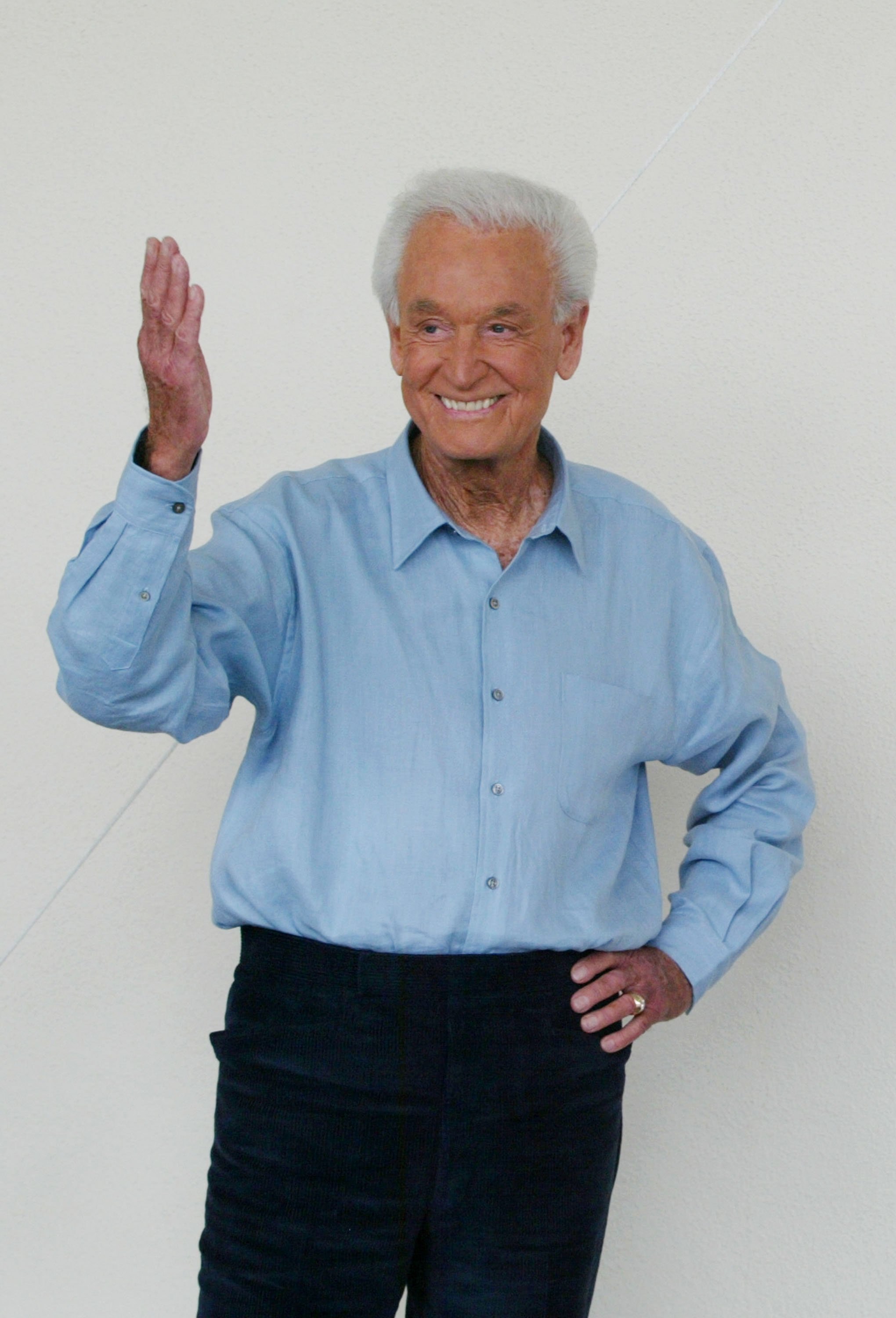 TV game show host Bob Barker reacts to a crowd greeting him as he arrives for the unveiling of a mural in his honor at CBS Television City on June 12, 2003, in Los Angeles, California | Source: Getty Images
