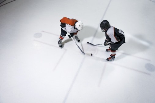 Youth hockey players face off | Photo: Getty Images
