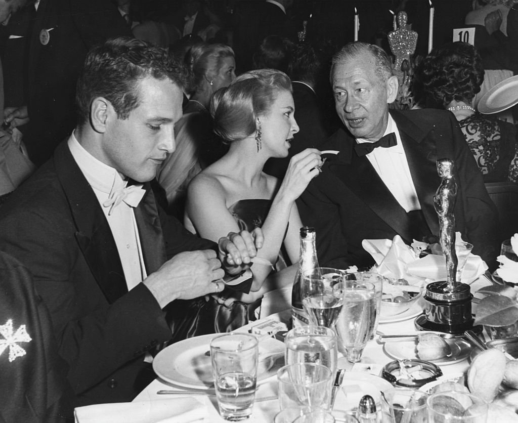 Actors Paul Newman and Joanne Woodward, and director Nunnally Johnson (right), at the 29th Academy Awards, March 27th 1957 | Source: Getty Images