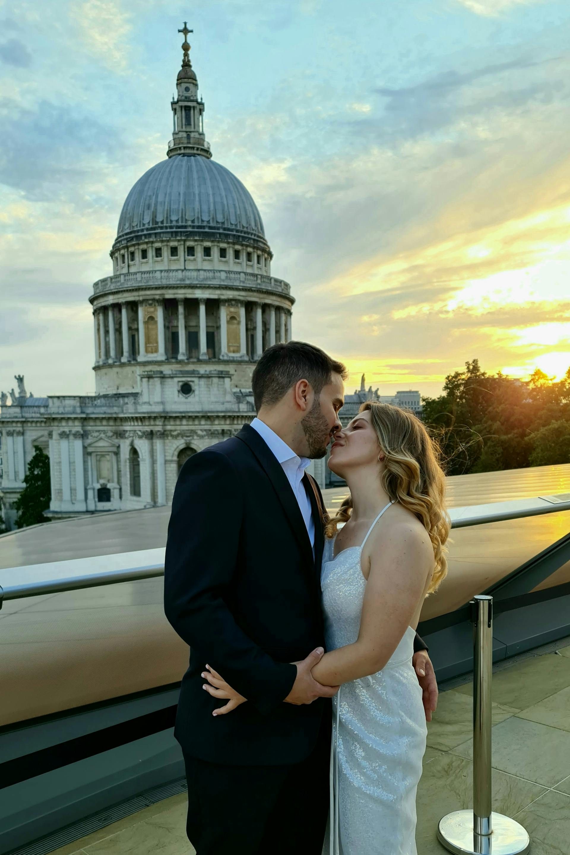 A man and woman about to kiss with a picturesque view in the background | Source: Pexels