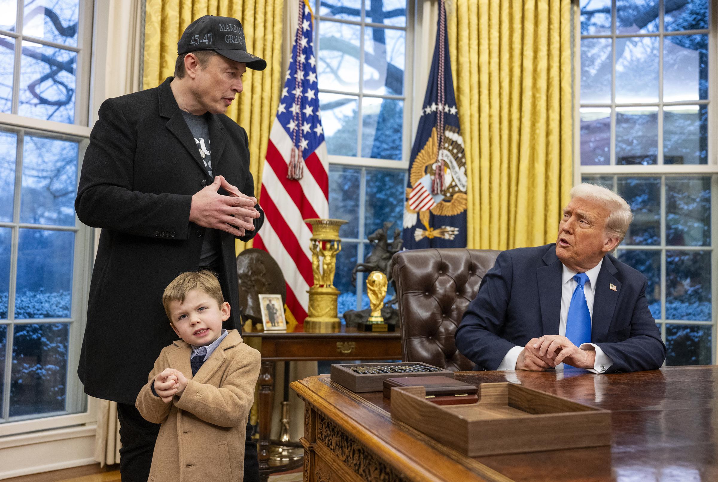 Elon Musk with his son X Æ A-Xii and US President Donald Trump during the signing of executive orders in the Oval Office of the White House in Washington, DC, on February 11, 2025 | Source: Getty Images