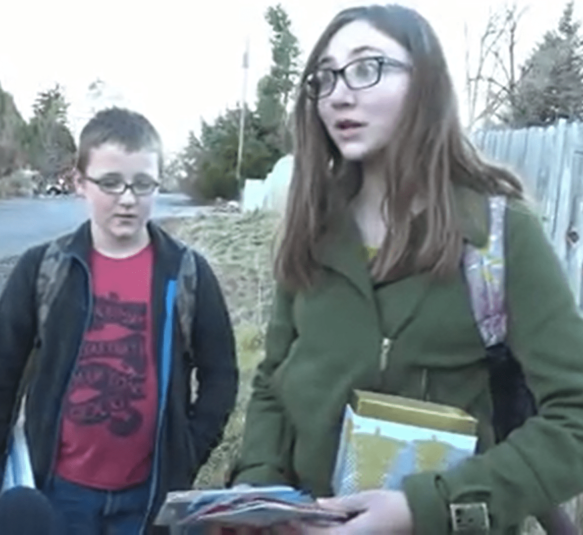 Emily looking amazed after receiving gifts from Secret Santa. | Source: youtube.com/East Idaho News 