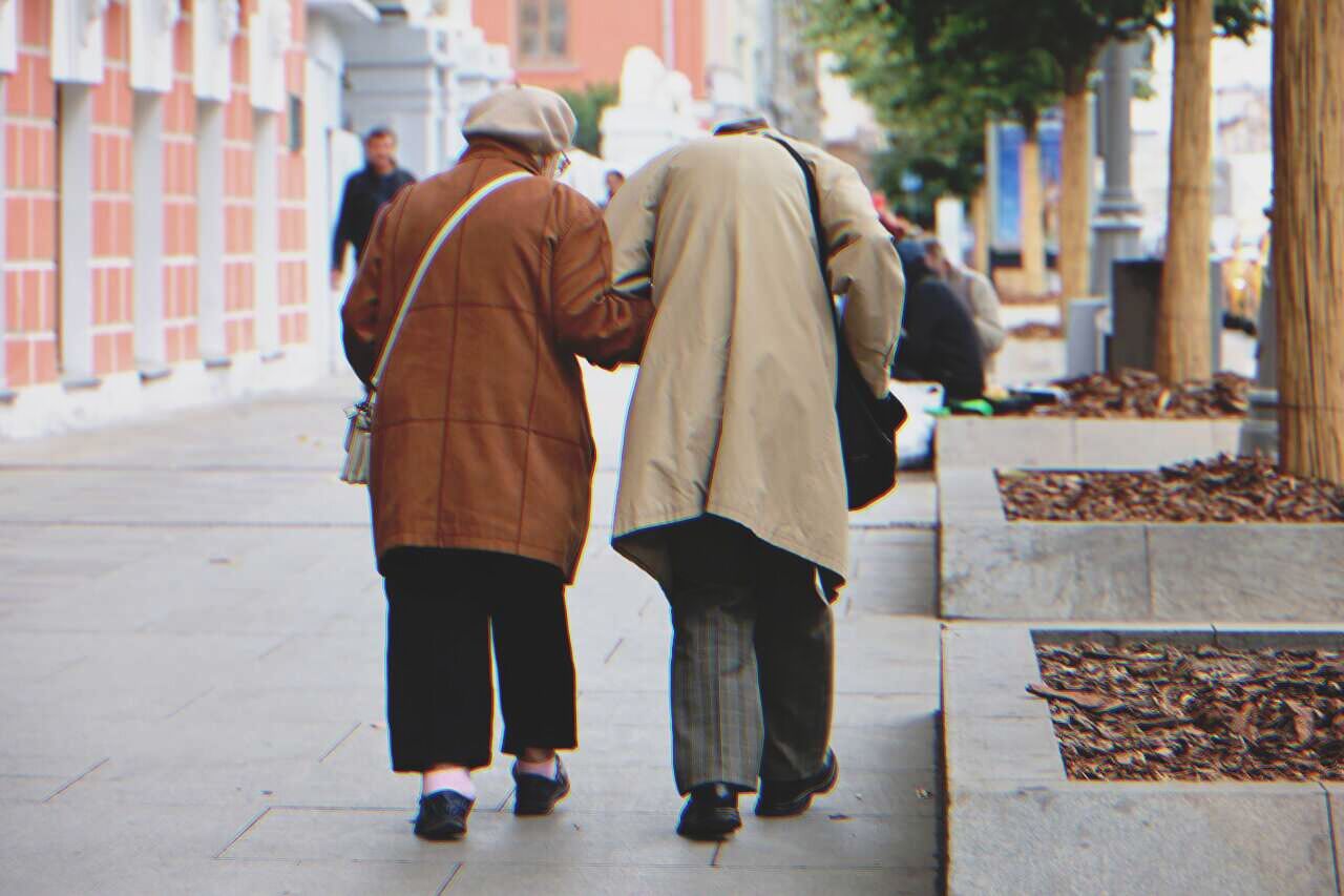 Senior couple walking hand in hand | Source: Shutterstock