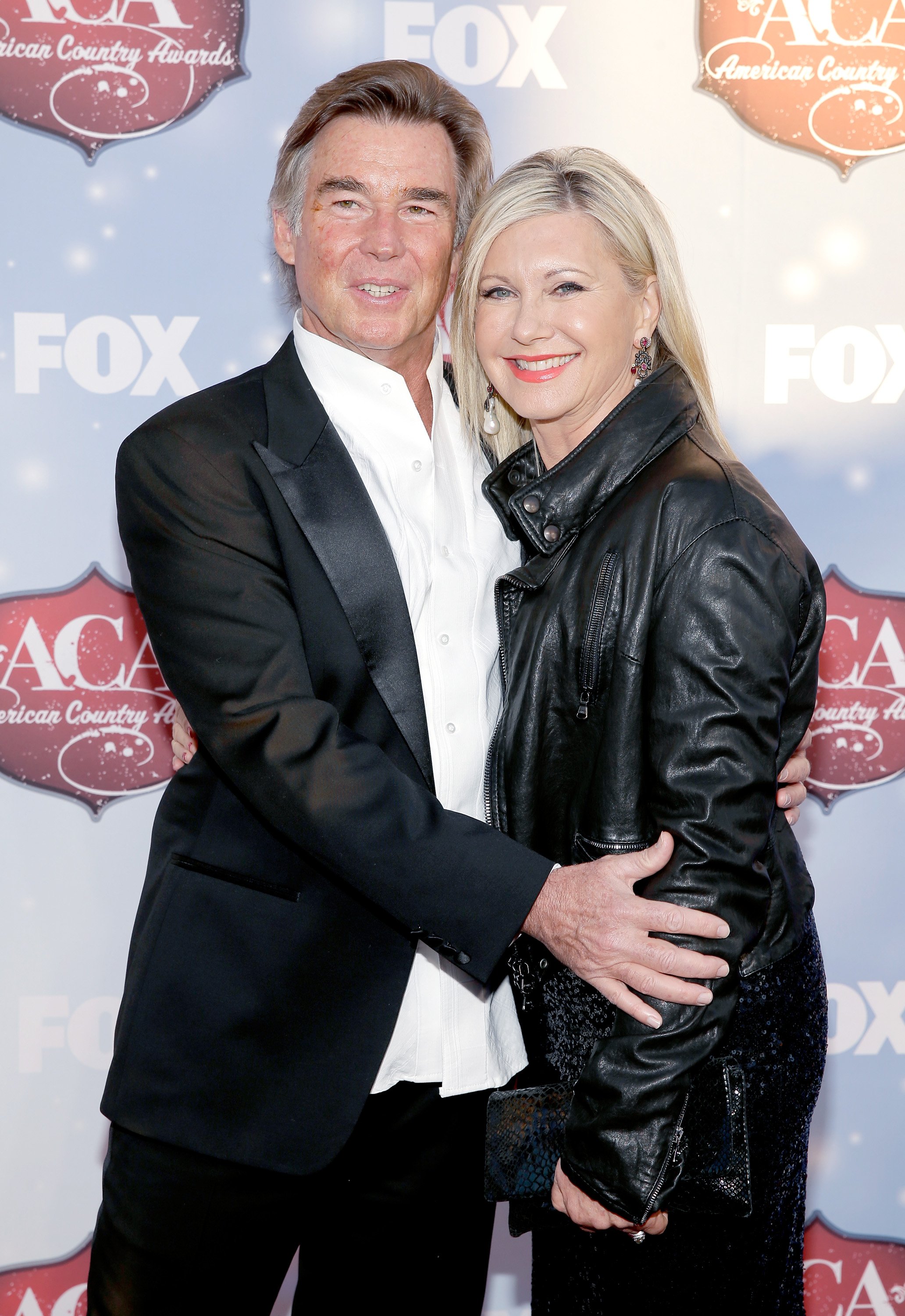 John Easterling and Olivia Newton-John at the American Country Awards on December 10, 2013 | Source: Getty Images