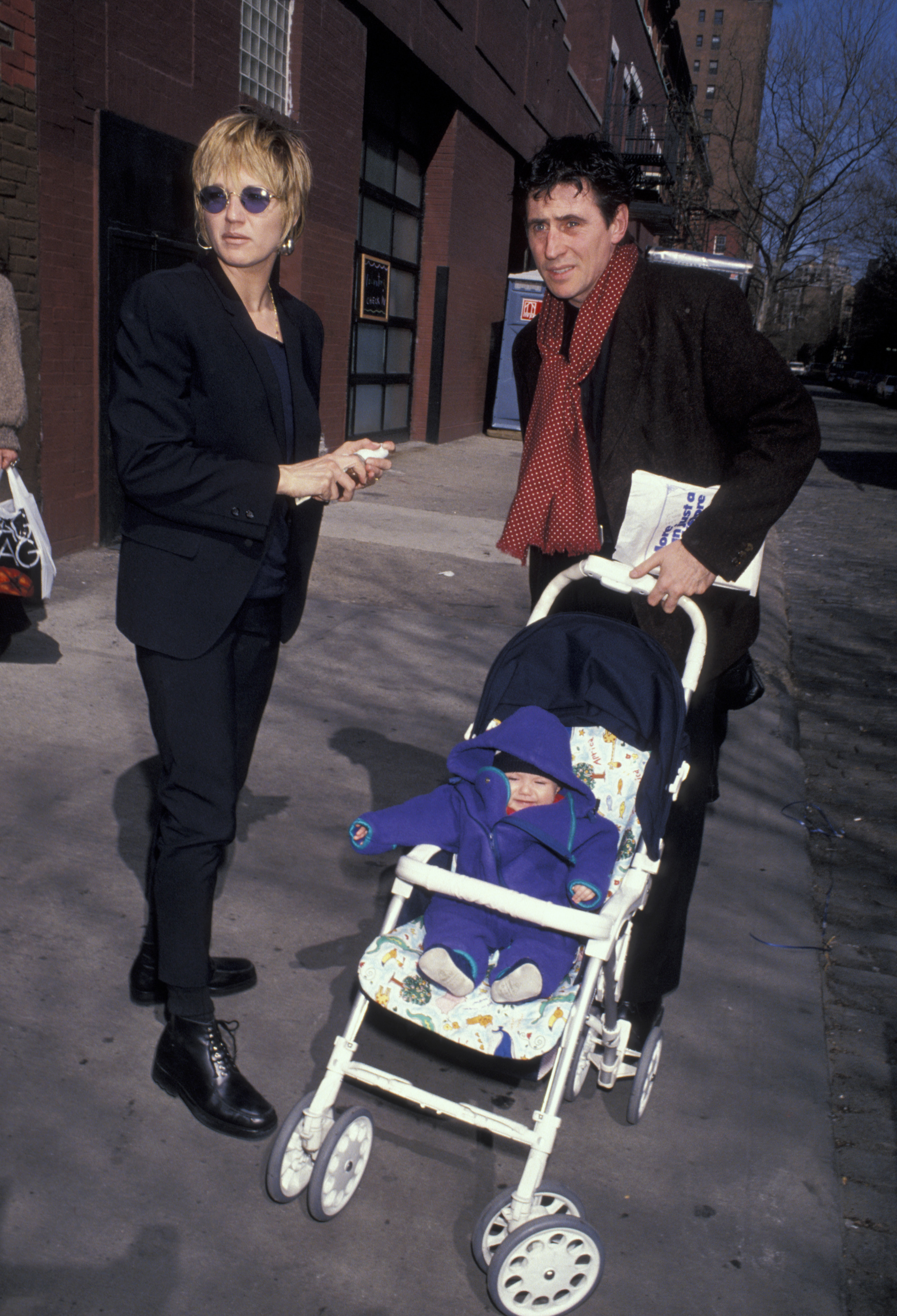 Ellen Barkin and her husband actor Gabriel Byrne pictured with their baby at the 1993 "Kids for Kids" Benefit on April 18, 1993 in New York | Source: Getty Images