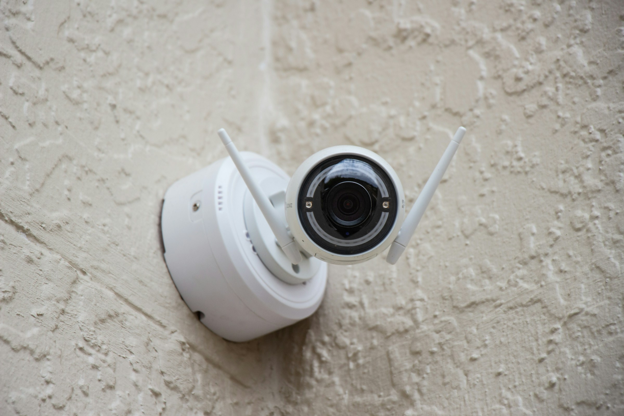 A white surveillance camera | Source: Unsplash