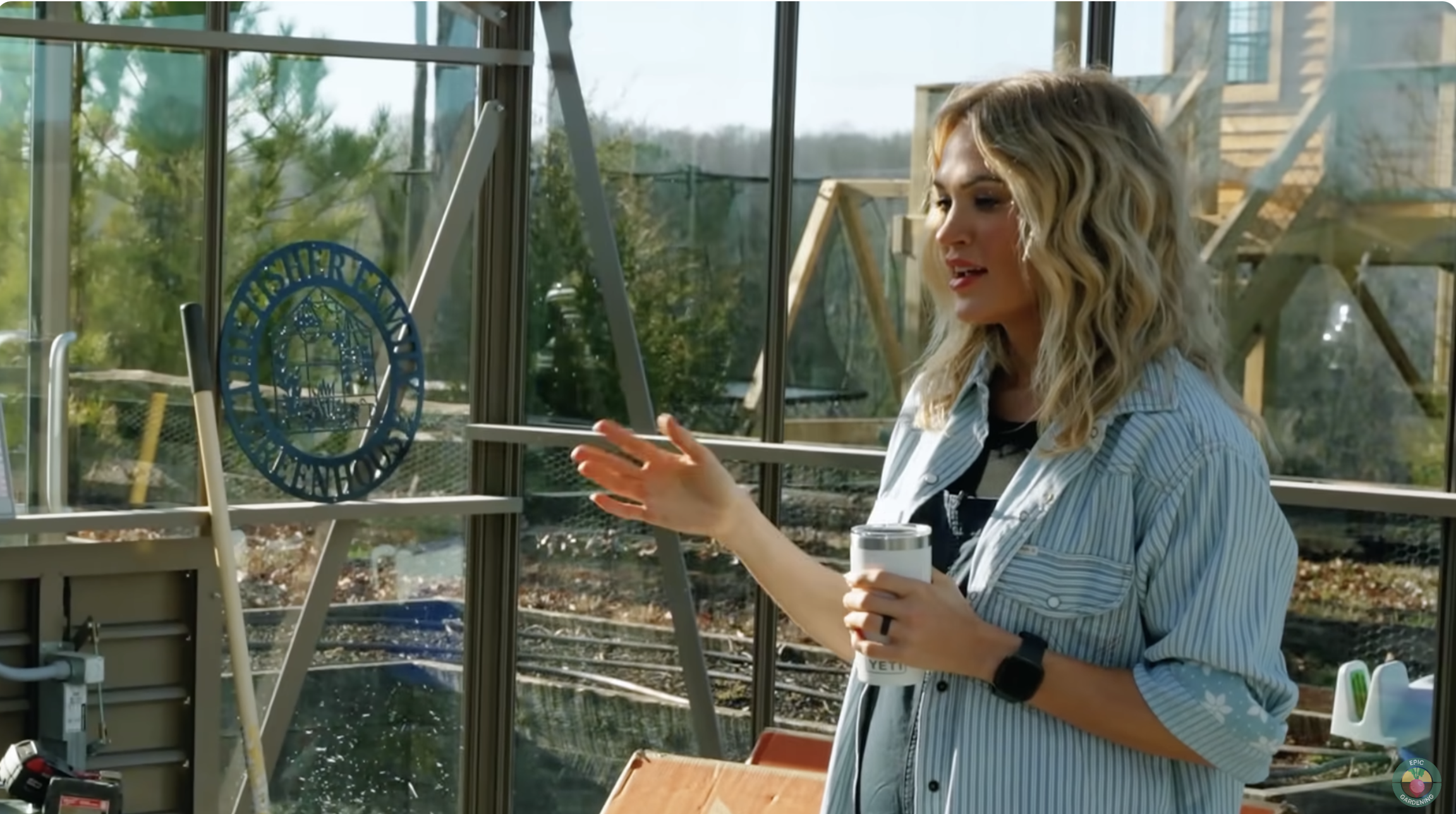 Carrie Underwood pictured in her greenhouse on February 18, 2023, in Franklin, Nashville. | Source: YouTube/EpicGardening