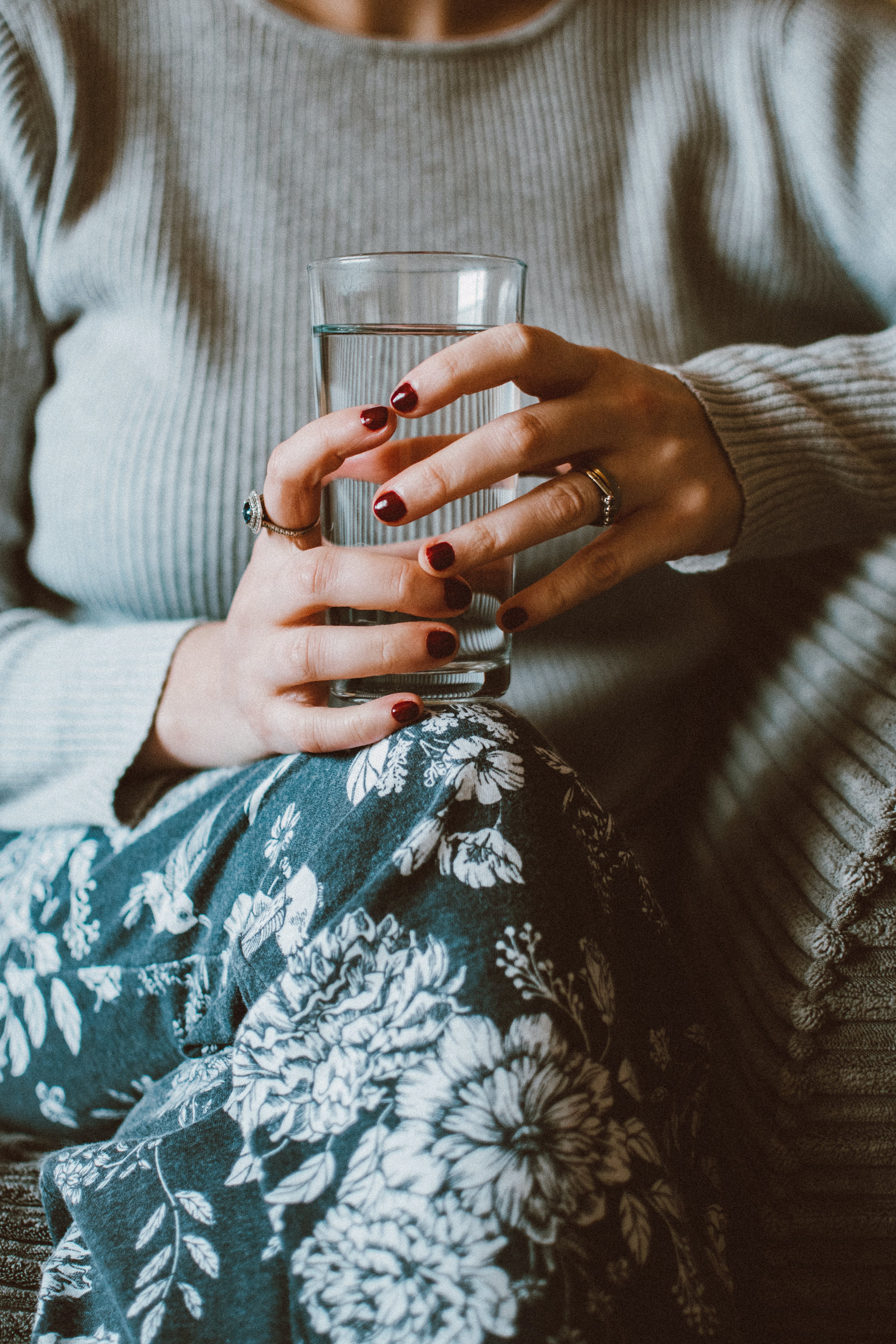 A person holding a glass of water. | Source: Pexels