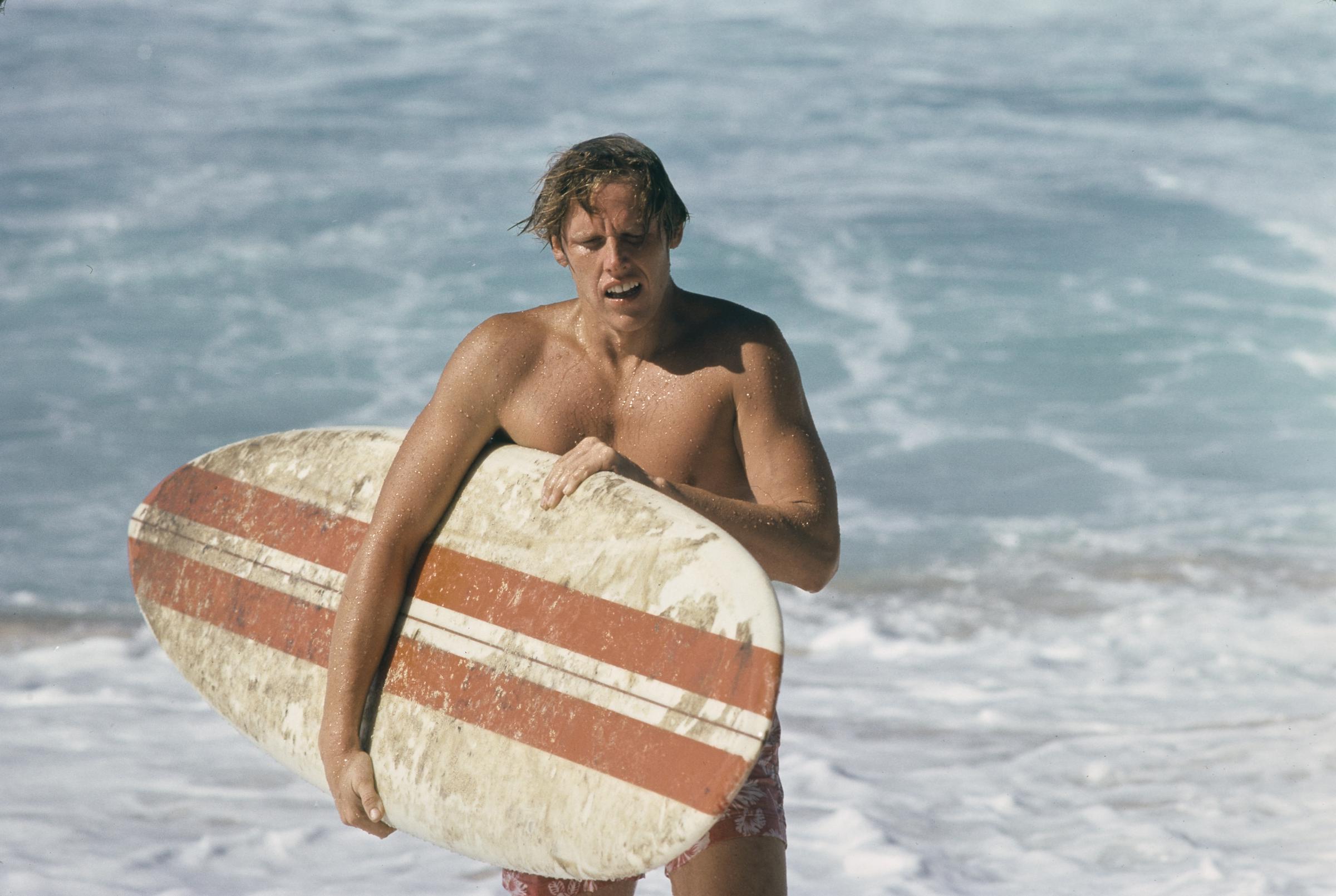 The actor pictured during the filming of "Big Wednesday," at Sunset Beach, on the north shore of Oahu (O'ahu), Hawaii, in September 1977 | Source: Getty Images