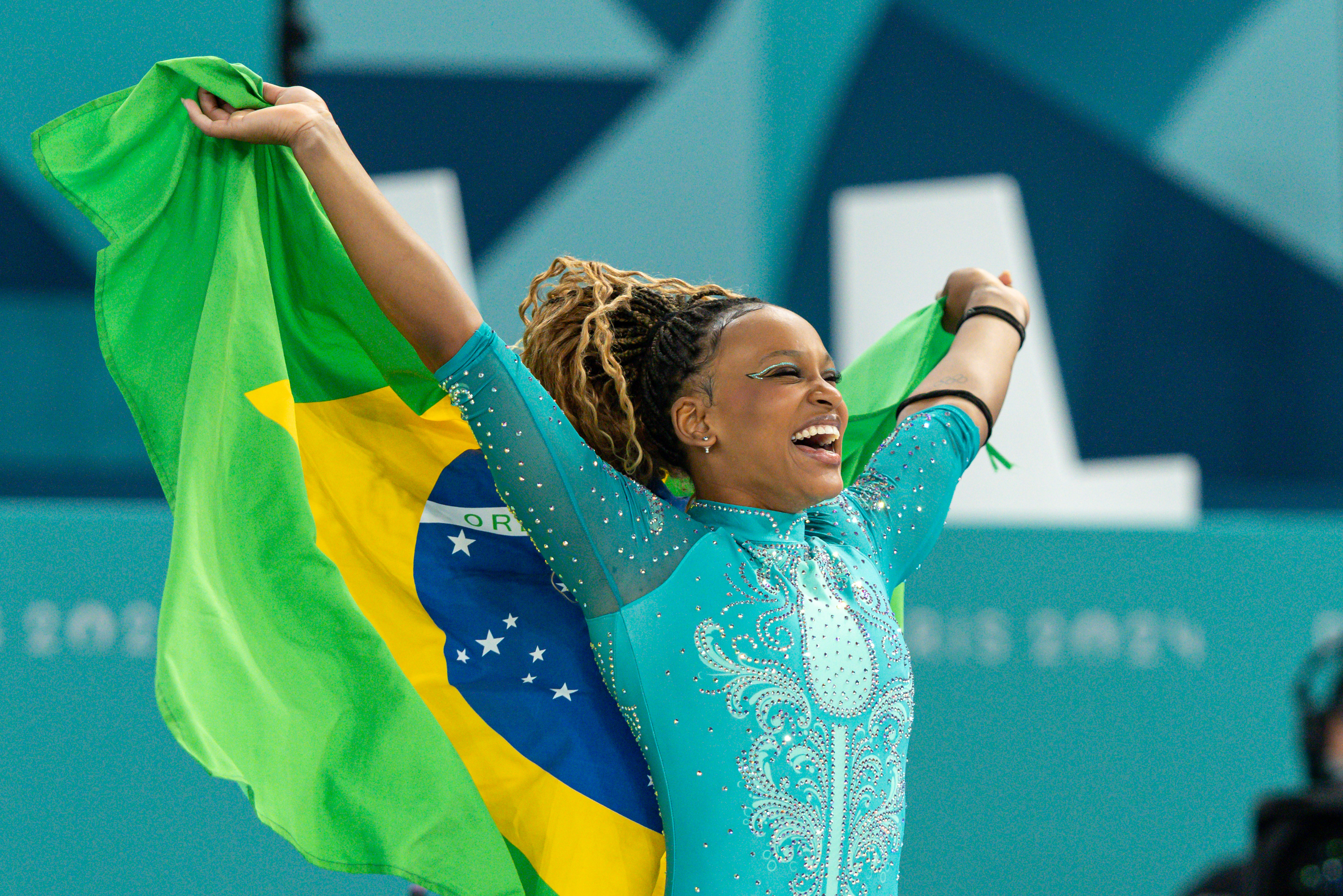 Rebeca Andrade of Brazil celebrates with the Brazilian flag while women´s floor exercise final on day ten of the Olympic Games Paris 2024 at Bercy Arena on August 05, 2024 in Paris, France | Source: Getty Images