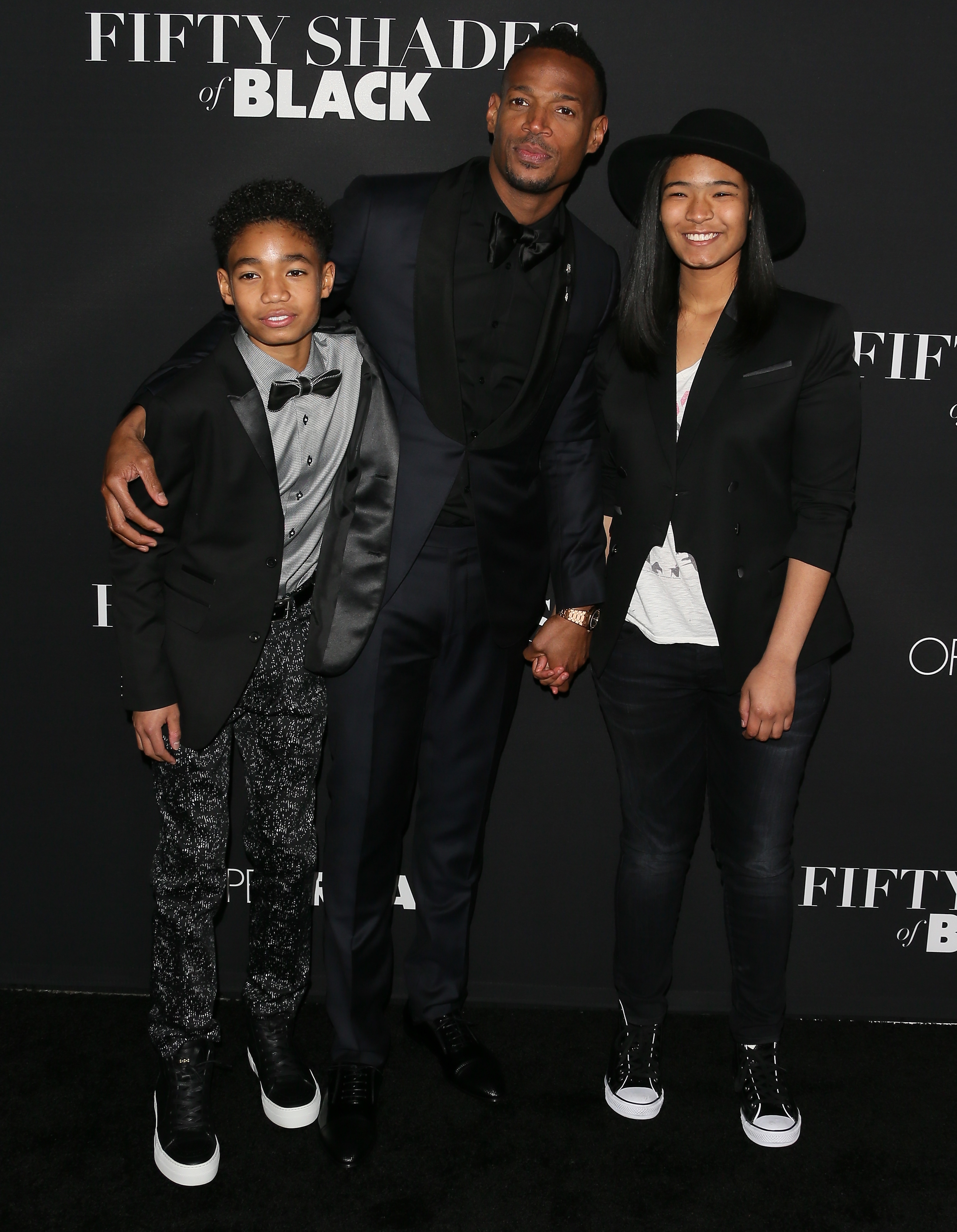 Marlon, Shawn, and Amai (now Kai) Wayans, arrive for the premiere of "Fifty Shades of Black" on January 26, 2016 | Source: Getty Images