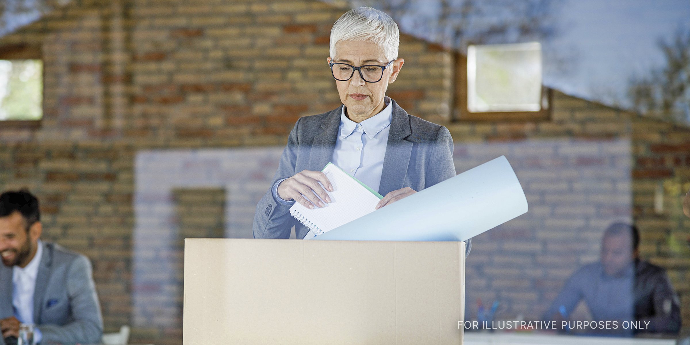Woman putting things away in a box | Source: Shutterstock