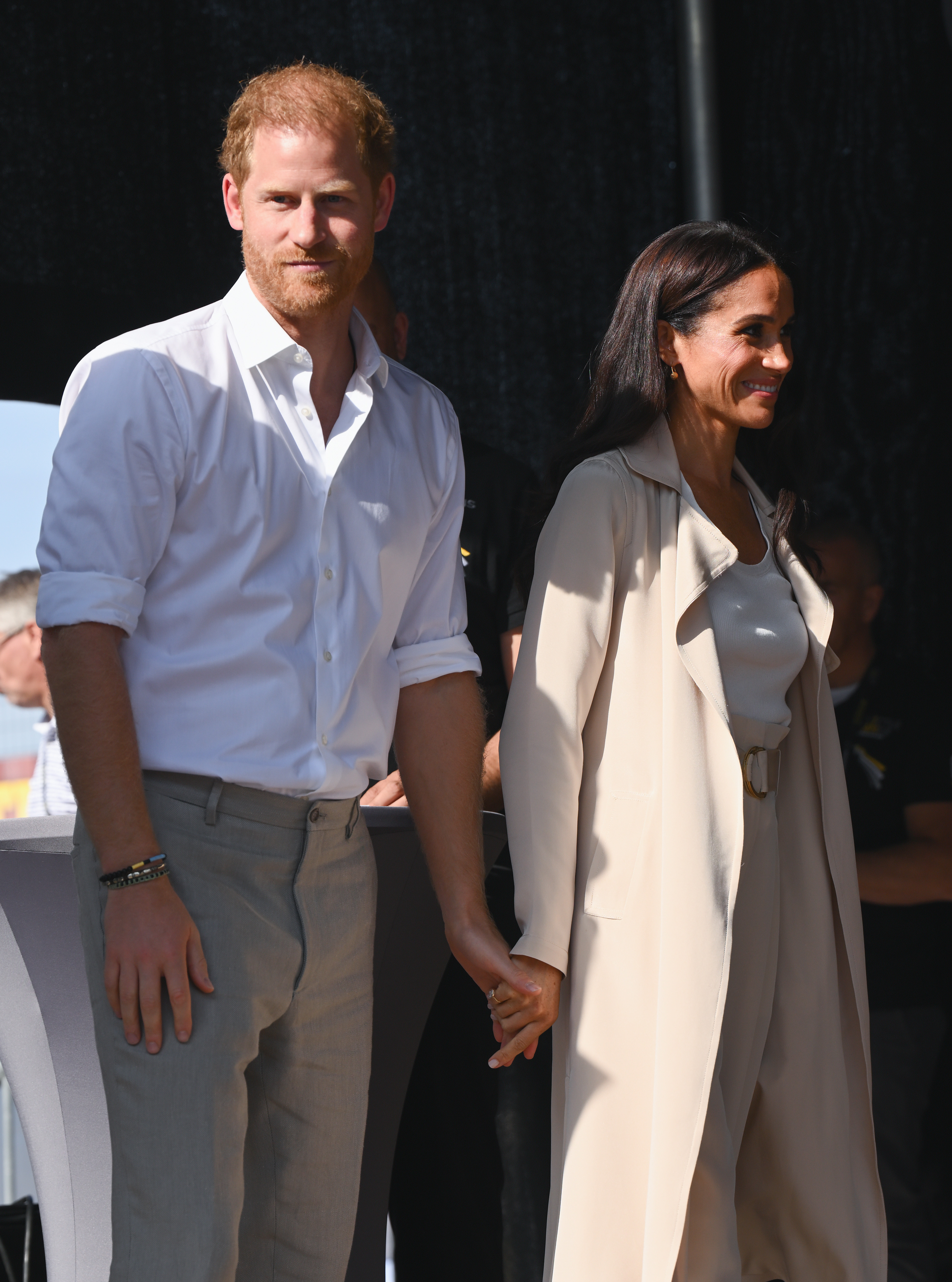 Prince Harry and Duchess Meghan at the swimming medal ceremony during the Invictus Games on September 16, 2023, in Dusseldorf, Germany | Source: Getty Images