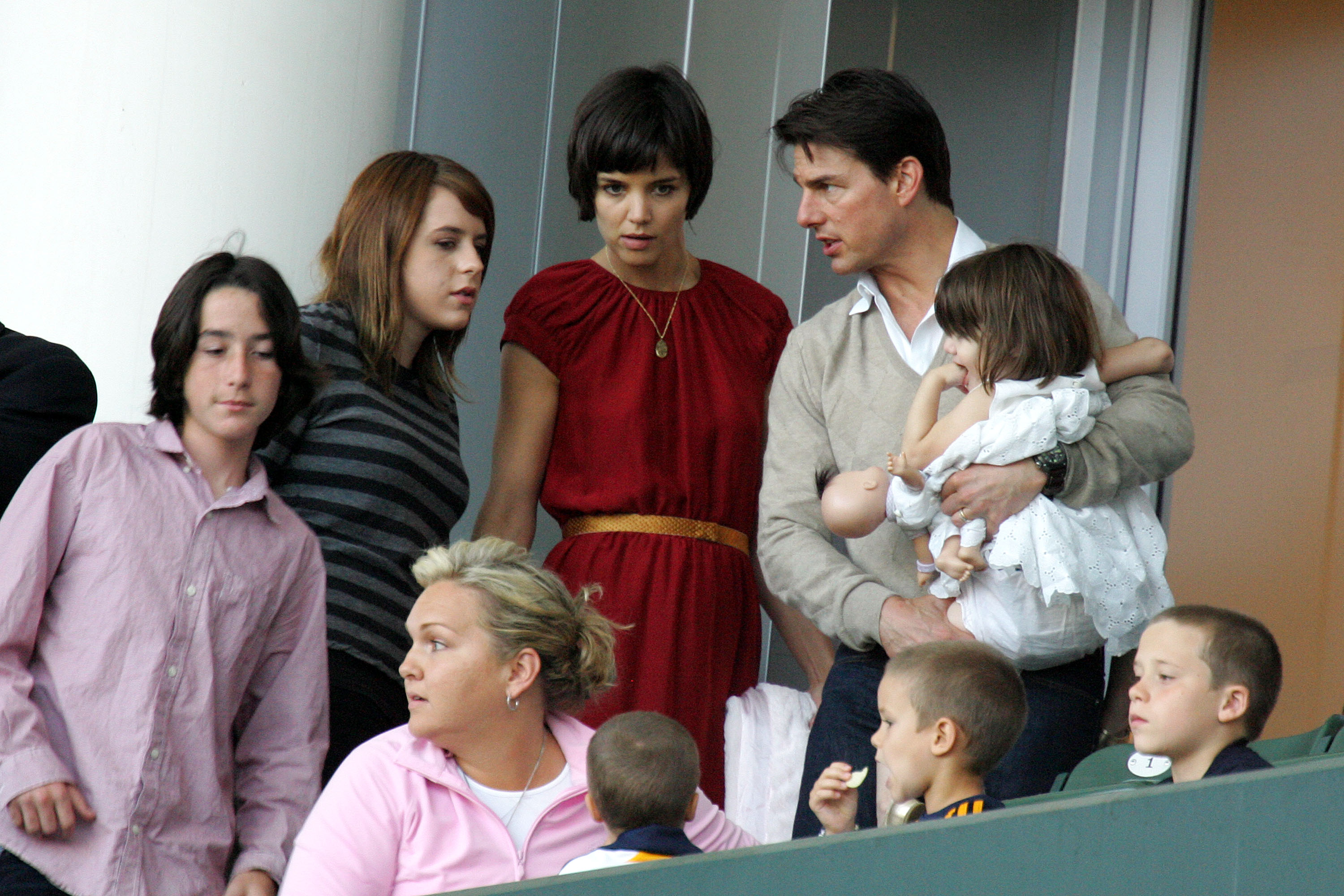 Tom Cruise and Katie Holmes with their daughters Suri Cruise and Isabella Kidman-Cruise and David Beckham's sons Brooklyn, Romeo, and Cruz Beckham, watch the Major League Soccer match on May 10, 2008, in Carson, California | Source: Getty Images