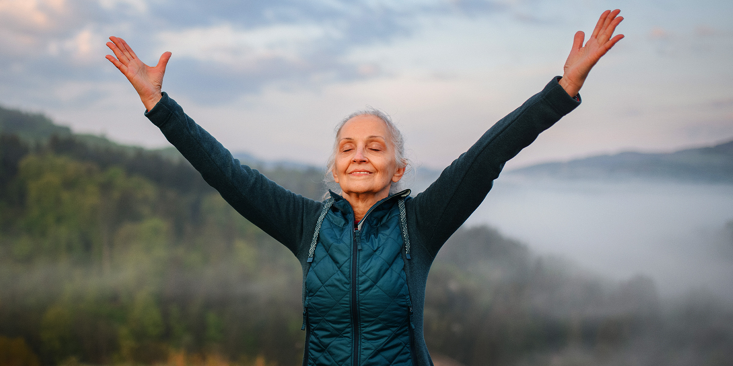 Senior woman doing breathing exercise | Source: Shutterstock