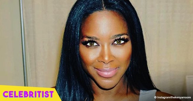 Kenya Moore is an excited mom-to-be as she cradles a baby in old pic