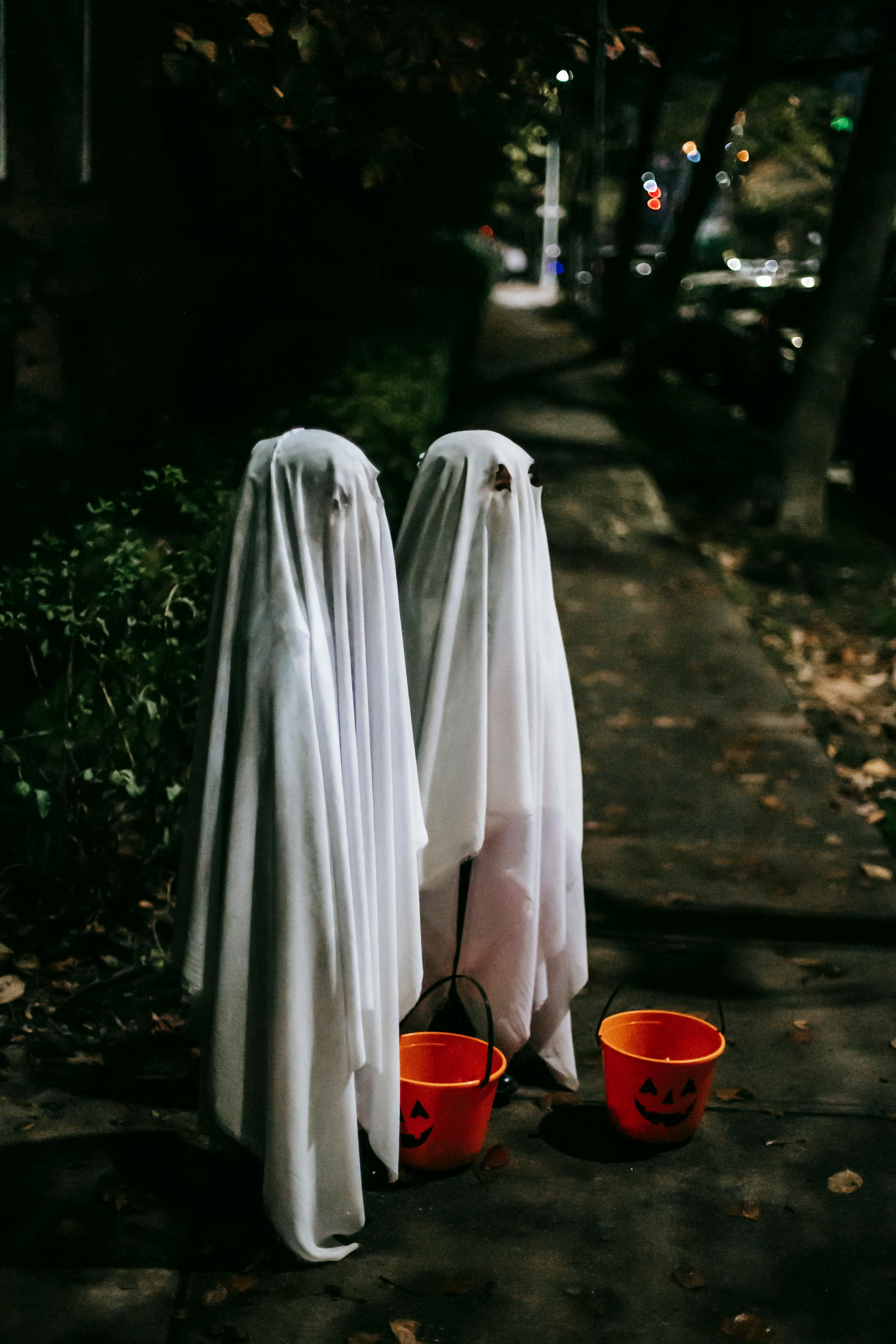 Children in ghost costumes | Source: Pexels
