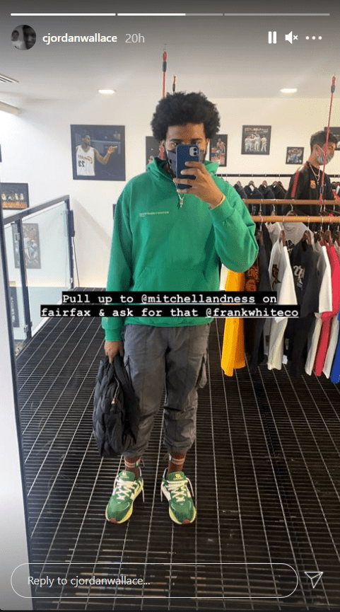 C.J. Wallace poses in a mirror selfie wearing a green hoodie. | Photo: Instagram/Cjordanwallace