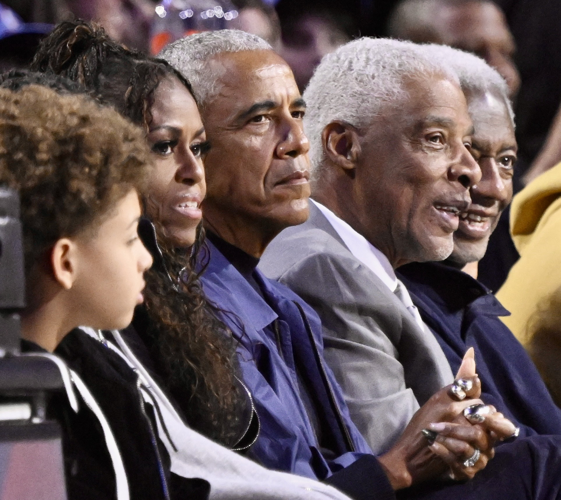 A close-up of Michelle and Barack Obama seated court side among other attendees. | Source: Getty Images