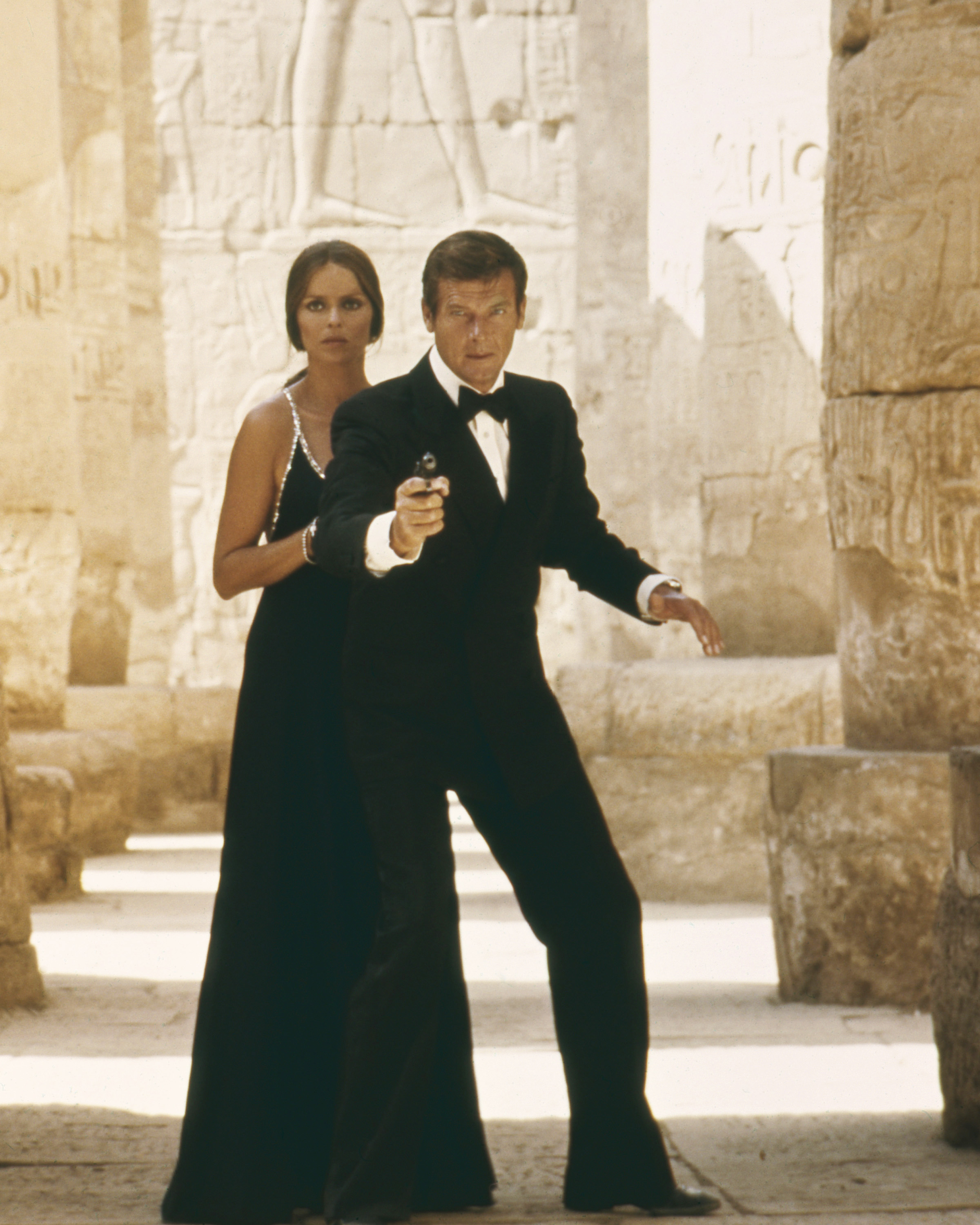 Barbara Bach and Roger Moore at the temple of Karnak in Egypt, in the film "The Spy Who Loved Me" in 1977. | Source: Getty Images