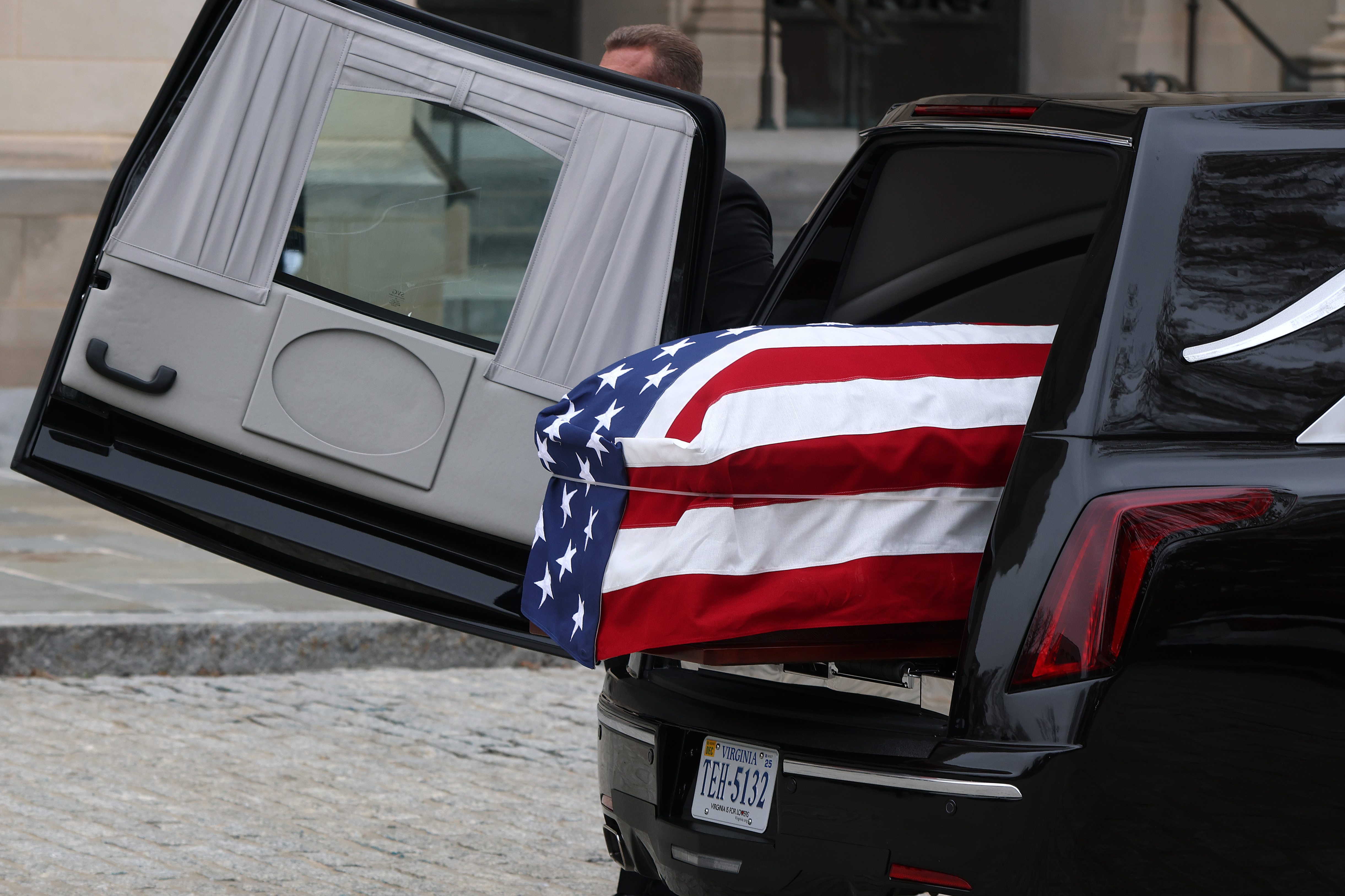 The casket containing the remains of former Vice President Dick Cheney arrives for his funeral at the National Cathedral on November 20, 2025 in Washington, DC.
