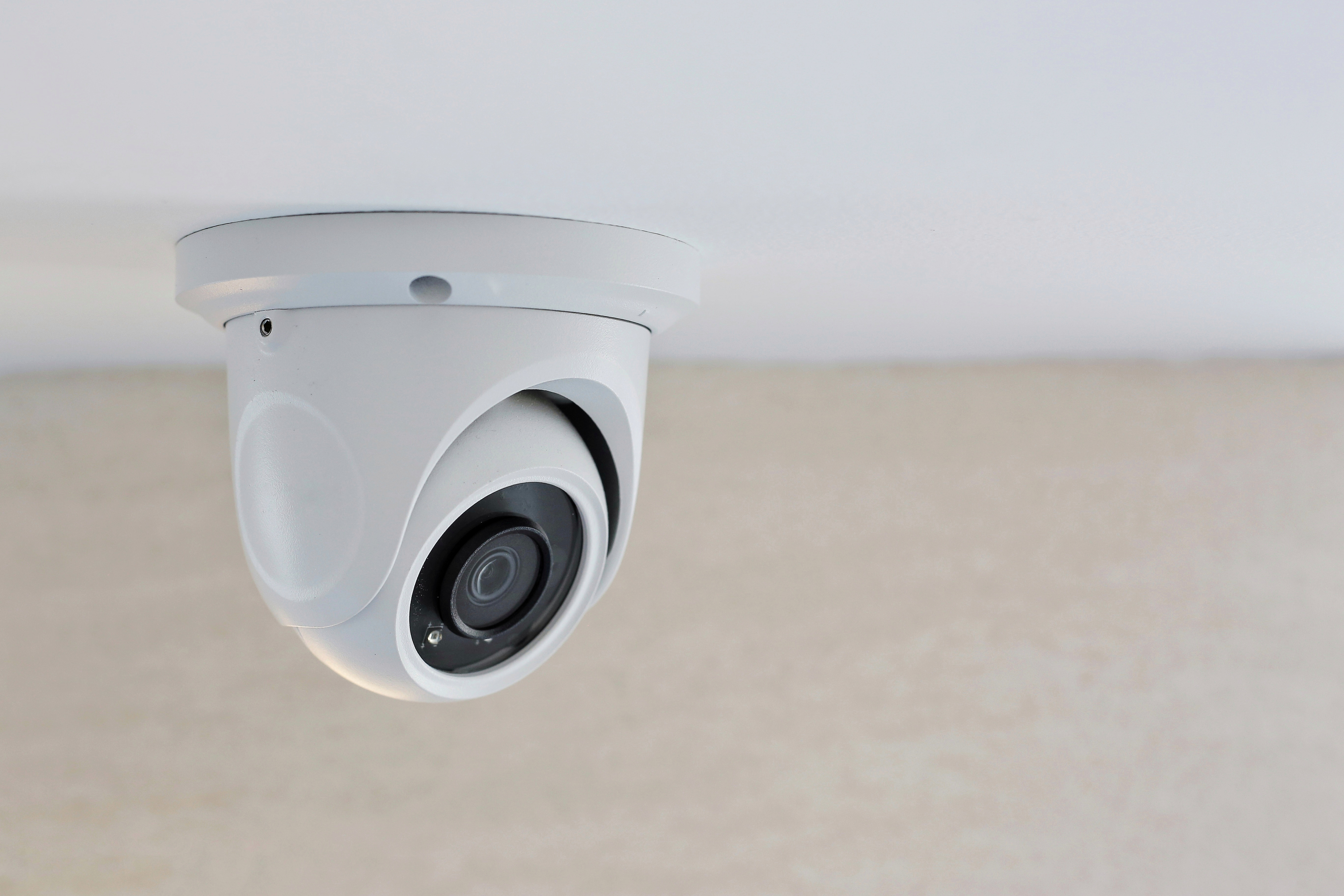 A CCTV camera on a ceiling | Source: Shutterstock