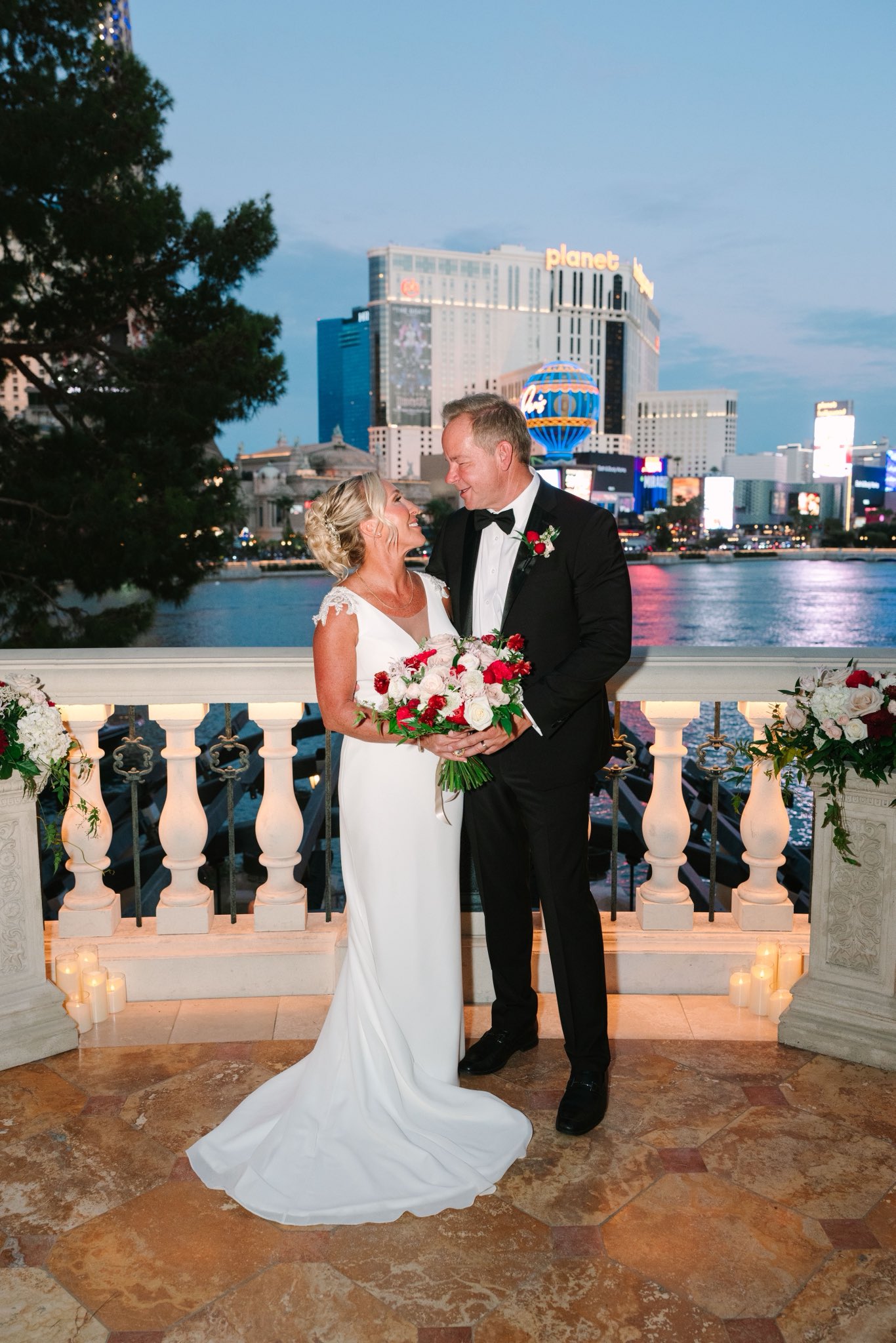 The happy couple shared a tender moment looking into each other's eyes along the romantic Bellagio balcony. With the glowing Las Vegas skyline in the background, they looked utterly smitten before heading off to celebrate. | Source: X/mtgreenee