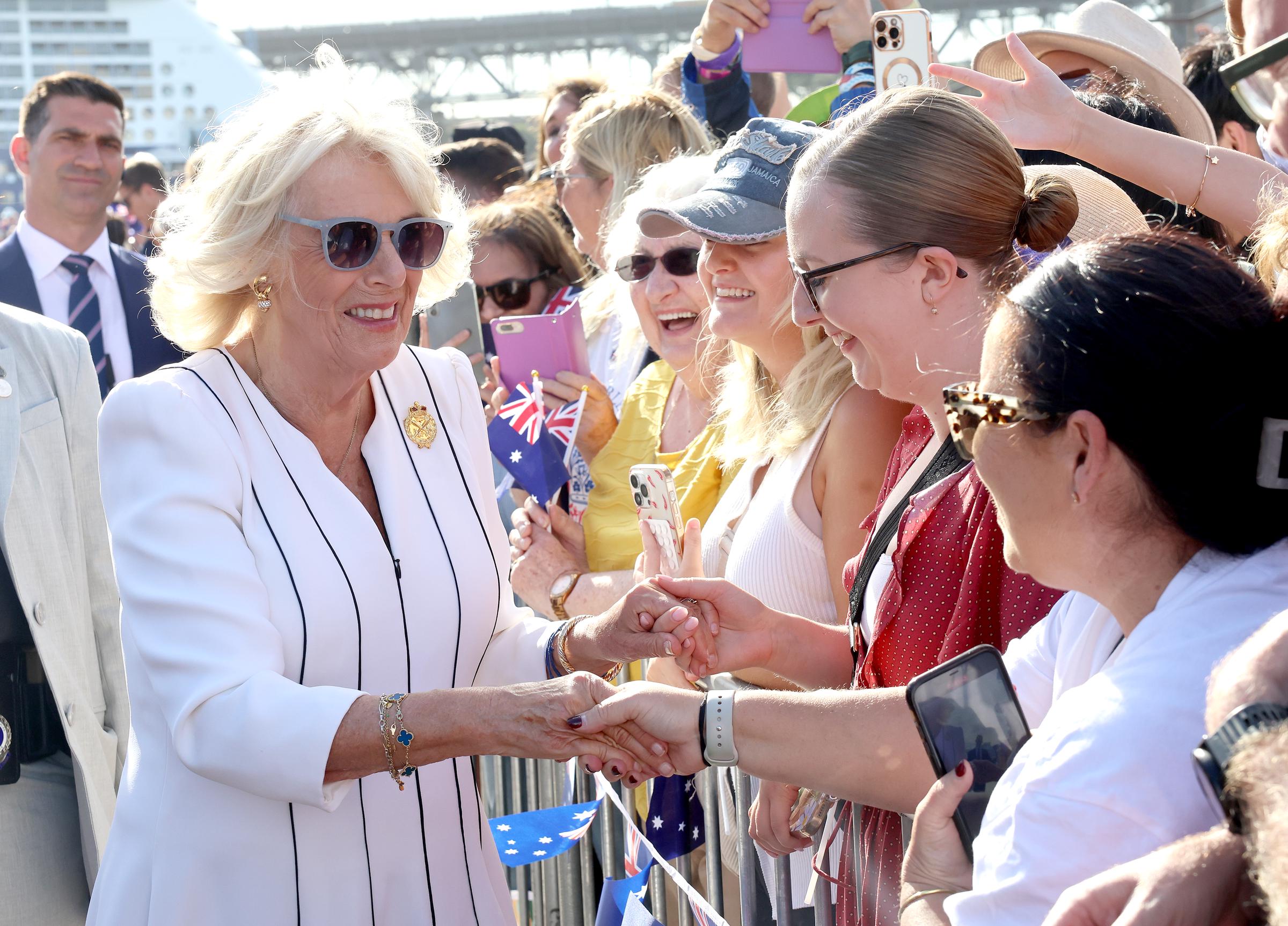 Queen Camilla meets members of the public during a walkabout at the Sydney Opera House on October 22, 2024, in Australia. | Source: Getty Images