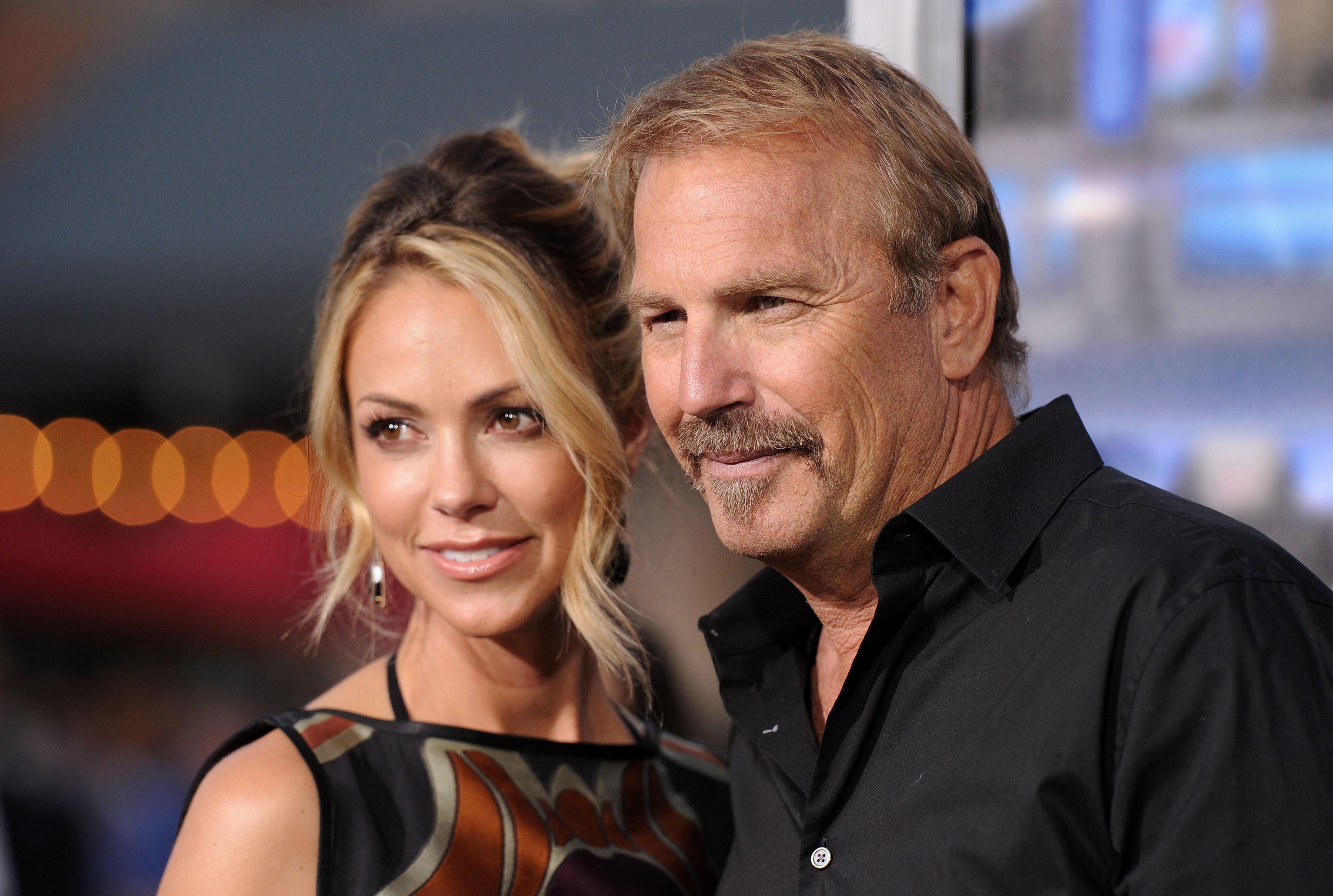 Kevin Costner and Christine Baumgartner on April 7, 2014, in Westwood, California | Source: Getty Images 
