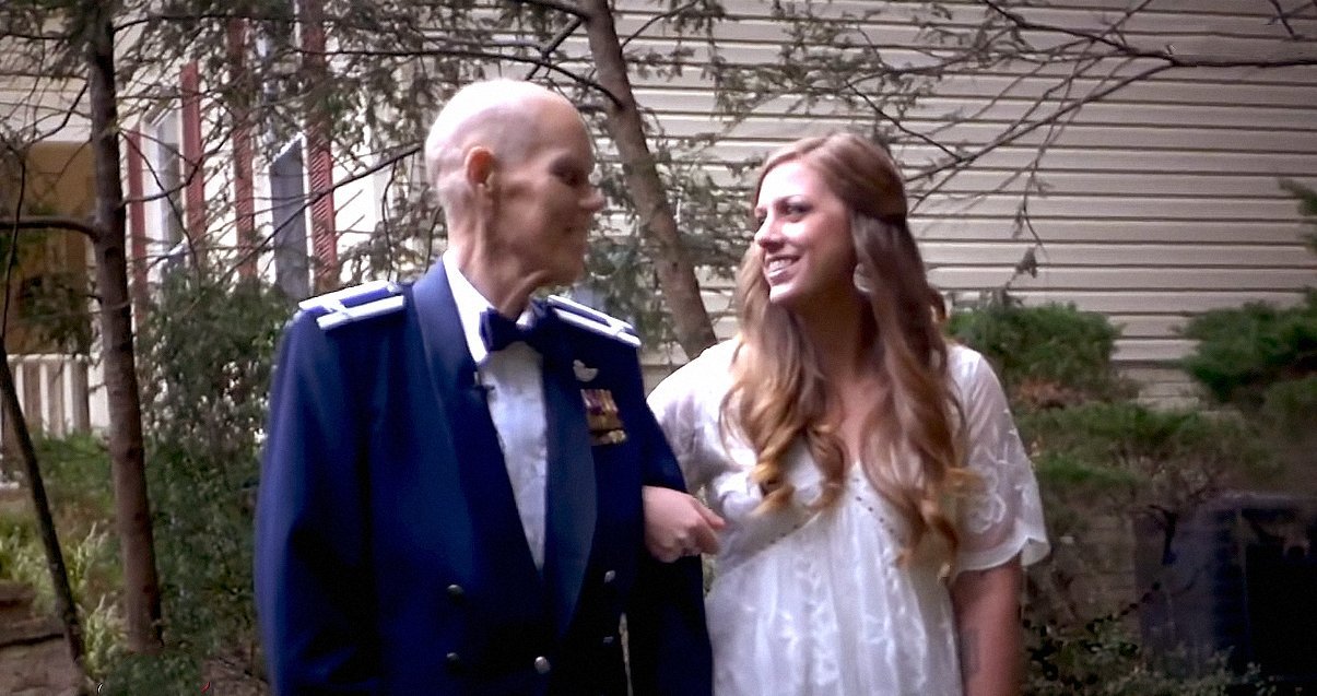 Becky Carey shares a priceless moment with her father, Timothy Carey during a photo shoot months before her wedding. | Source: YouTube/InsideEdition