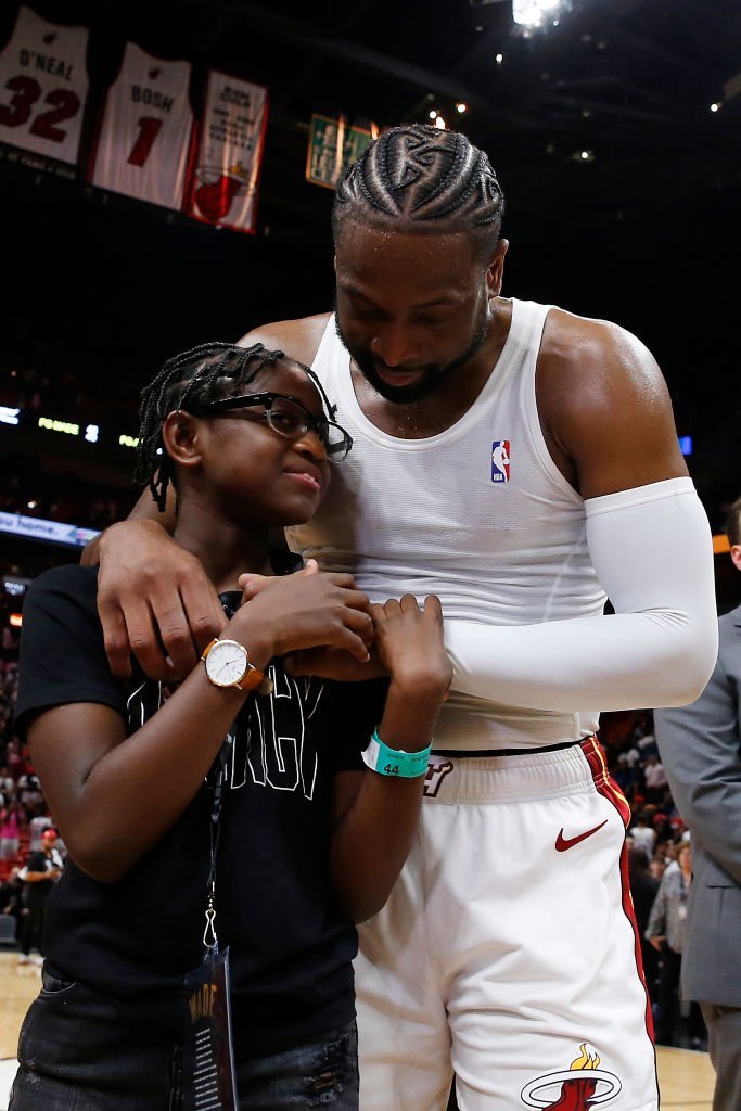 Dwyane Wade hugs his daughter, Zaya Wade, after his final home game at American Airlines Arena on April 09, 2019, in Miami, Florida | Source: Michael Reaves/Getty Images