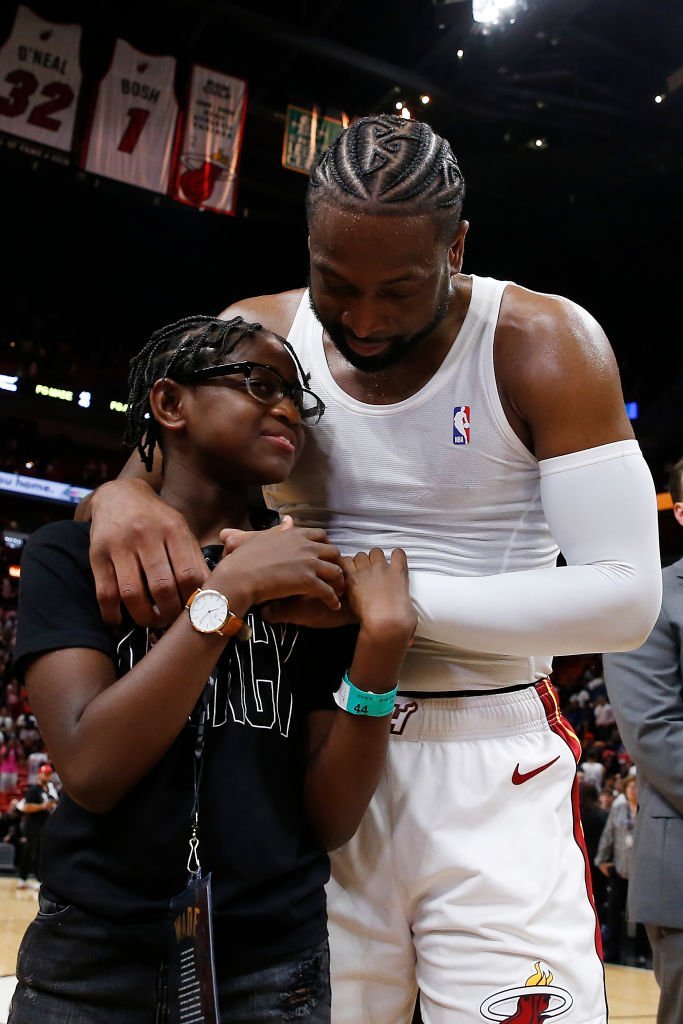 Dwyane Wade hugs his daughter, Zaya Wade, after his final home game at American Airlines Arena on April 09, 2019, in Miami, Florida | Photo: Getty Images