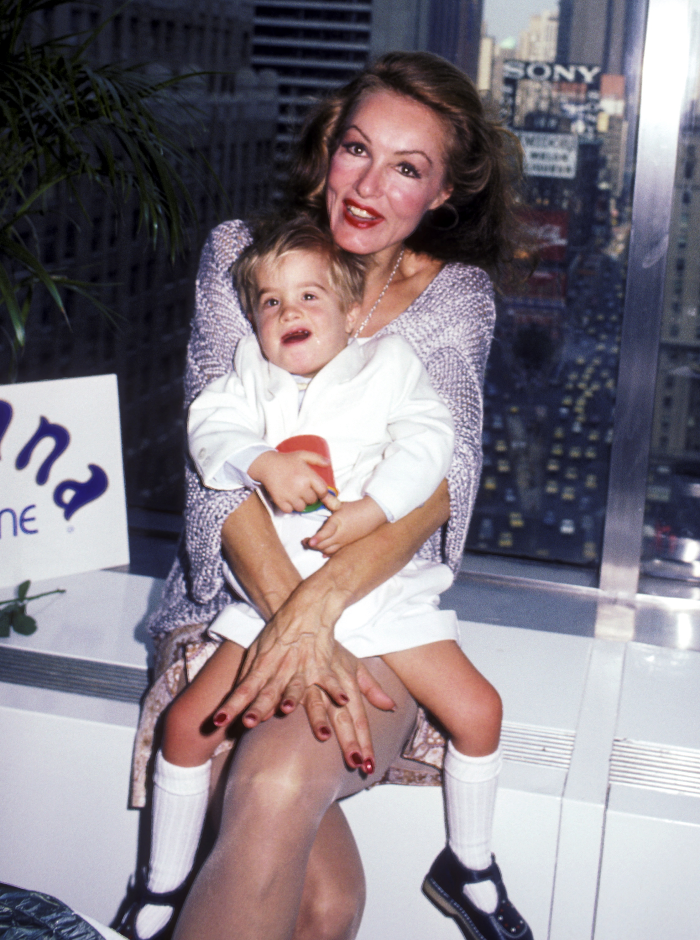 Actress Julie Newmar and son John attend her 51st birthday party on August 16, 1984 at Nirvana Club One in New York City | Source: Getty Images